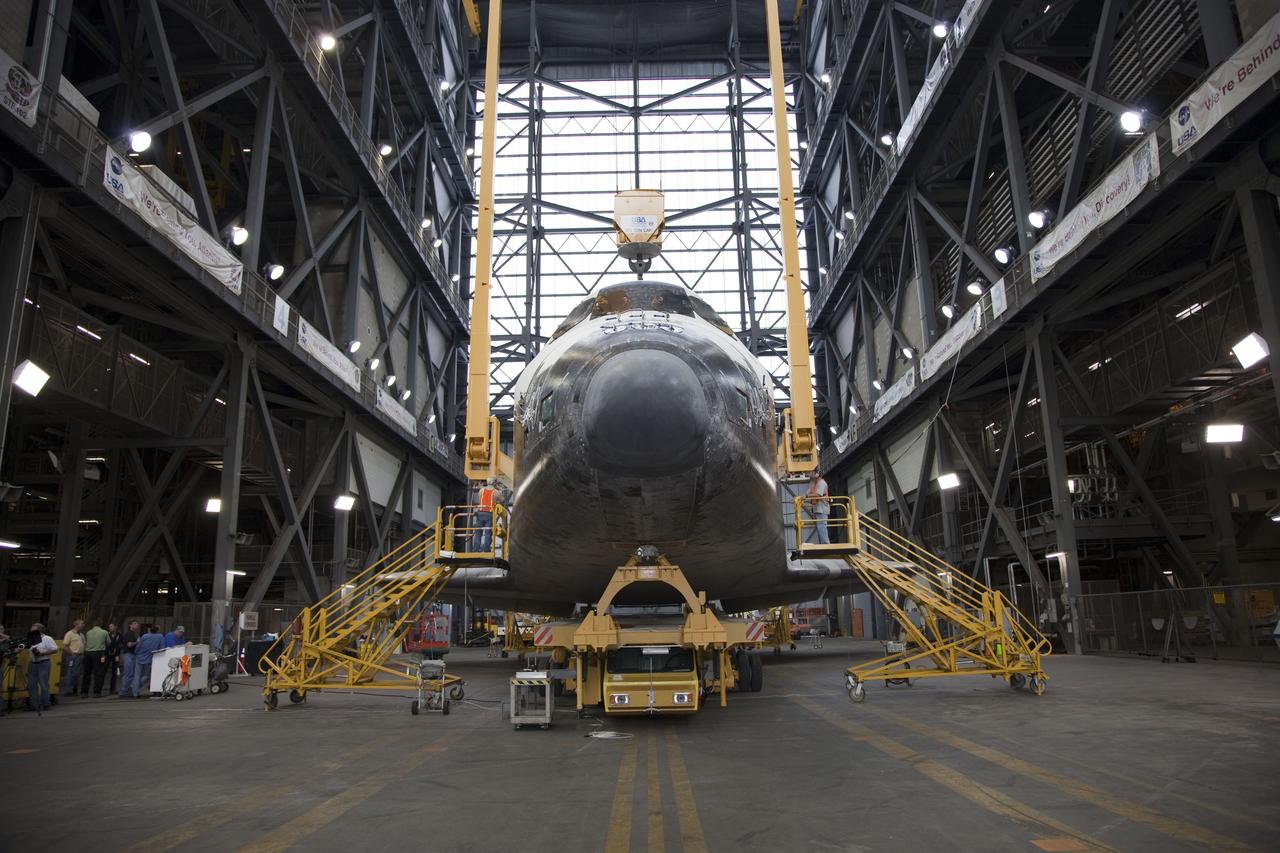 CAPE CANAVERAL, Fla. -- In the transfer aisle of the Vehicle Assembly Building at NASA's Kennedy Space Center in Florida, workers attach an overhead crane to space shuttle Endeavour. The crane will lift the spacecraft into a high bay where it will be attached to its external fuel tank and solid rocket boosters for its final mission, STS-134. Endeavour and its STS-134 crew will deliver the Express Logistics Carrier-3, Alpha Magnetic Spectrometer, a high-pressure gas tank, additional spare parts for Dextre and micrometeoroid debris shields to the International Space Station. Launch is targeted for April 19 at 7:48 p.m. EDT. For more information visit, http://www.nasa.gov/mission_pages/shuttle/shuttlemissions/sts134/index.html. Photo credit: NASA/Frankie Martin