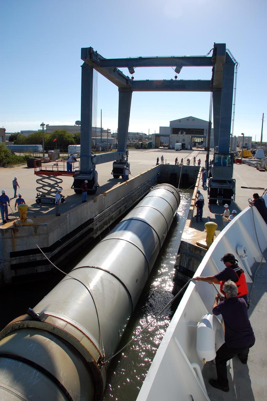 CAPE CANAVERAL, Fla. -- The Solid Rocket Booster Retrieval Ship Freedom Star delivers a spent shuttle booster to workers at Hangar AF at Cape Canaveral Air Force Station in Florida. The booster was used during space shuttle Discovery's STS-133 launch from NASA Kennedy Space Center's Launch Pad 39A on Feb. 24. The shuttle’s two solid rocket booster casings and associated flight hardware are recovered in the Atlantic Ocean after every launch by Freedom Star and Liberty Star. The boosters impact the Atlantic about seven minutes after liftoff and the retrieval ships are stationed about 10 miles from the impact area at the time of splashdown.  After the spent segments are processed, they will be transported to Utah, where they will be refurbished and stored, if needed. Photo credit: NASA/Ben Smegelsky