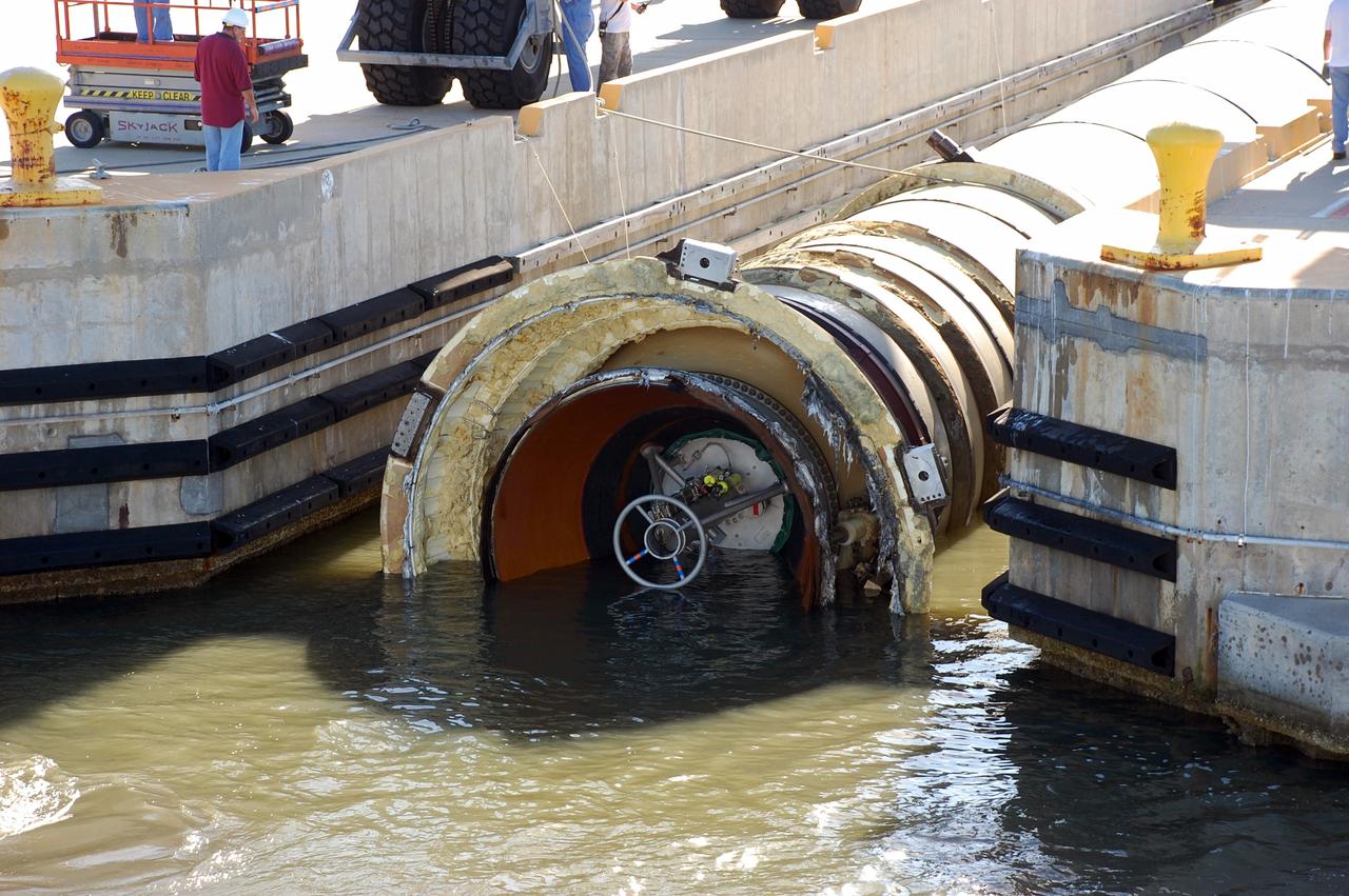 CAPE CANAVERAL, Fla. -- The Solid Rocket Booster Retrieval Ship Freedom Star delivers a spent shuttle booster to workers at Hangar AF at Cape Canaveral Air Force Station in Florida. The booster was used during space shuttle Discovery's STS-133 launch from NASA Kennedy Space Center's Launch Pad 39A on Feb. 24. The shuttle’s two solid rocket booster casings and associated flight hardware are recovered in the Atlantic Ocean after every launch by Freedom Star and Liberty Star. The boosters impact the Atlantic about seven minutes after liftoff and the retrieval ships are stationed about 10 miles from the impact area at the time of splashdown.  After the spent segments are processed, they will be transported to Utah, where they will be refurbished and stored, if needed. Photo credit: NASA/Ben Smegelsky