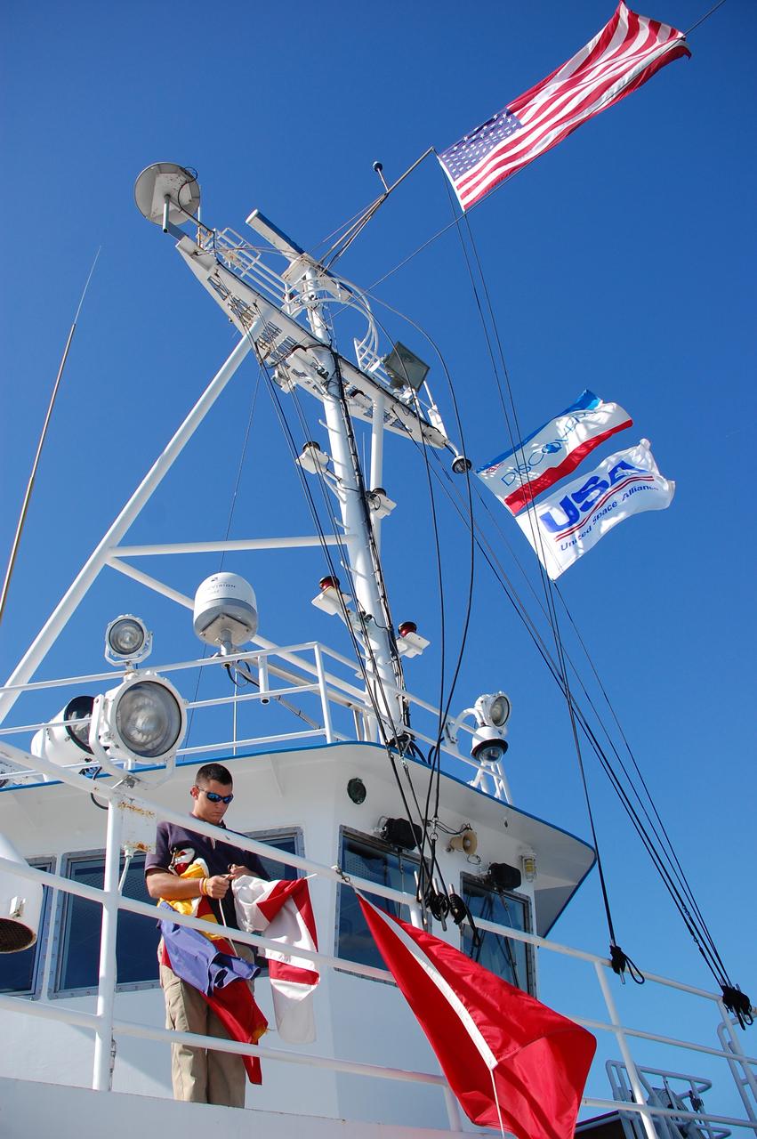 CAPE CANAVERAL, Fla. -- The Solid Rocket Booster Retrieval Ship Freedom Star delivers a spent shuttle booster to workers at Hangar AF at Cape Canaveral Air Force Station in Florida. The booster was used during space shuttle Discovery's STS-133 launch from NASA Kennedy Space Center's Launch Pad 39A on Feb. 24. The shuttle’s two solid rocket booster casings and associated flight hardware are recovered in the Atlantic Ocean after every launch by Freedom Star and Liberty Star. The boosters impact the Atlantic about seven minutes after liftoff and the retrieval ships are stationed about 10 miles from the impact area at the time of splashdown.  After the spent segments are processed, they will be transported to Utah, where they will be refurbished and stored, if needed. Photo credit: NASA/Ben Smegelsky