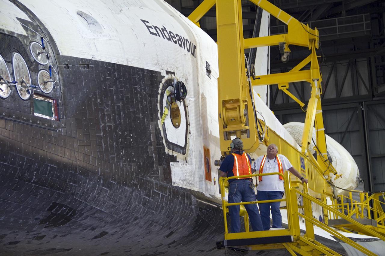 CAPE CANAVERAL, Fla. -- In the Vehicle Assembly Building at NASA's Kennedy Space Center in Florida, workers attach an overhead crane to shuttle Endeavour. The crane will lift the spacecraft into a high bay where it will be attached to the waiting external fuel tank and solid rocket boosters.              Endeavour and its STS-134 crew will deliver the Express Logistics Carrier-3, Alpha Magnetic Spectrometer, a high-pressure gas tank, additional spare parts for Dextre and micrometeoroid debris shields to the International Space Station. Endeavour's final launch is targeted for April 19 at 7:48 p.m. EDT. For more information visit, http://www.nasa.gov/mission_pages/shuttle/shuttlemissions/sts134/index.html. Photo credit: NASA/Jack Pfaller