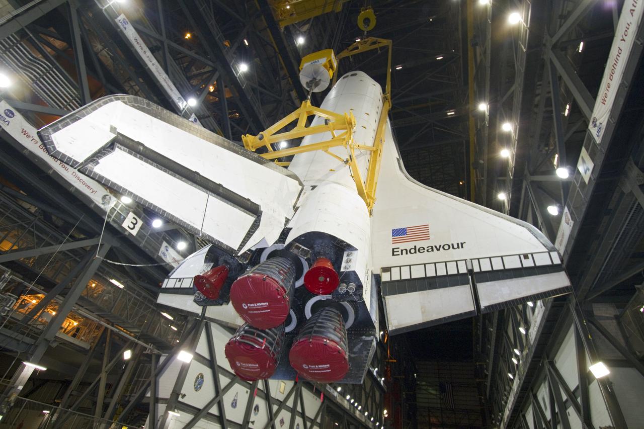 CAPE CANAVERAL, Fla. -- In Vehicle Assembly Building at NASA's Kennedy Space Center in Florida, shuttle Endeavour is suspended vertically over the transfer aisle. The spacecraft will be moved into a high bay where it will be installed to the waiting external fuel tank and solid rocket boosters.            Endeavour and its STS-134 crew will deliver the Express Logistics Carrier-3, Alpha Magnetic Spectrometer, a high-pressure gas tank, additional spare parts for Dextre and micrometeoroid debris shields to the International Space Station. Endeavour's final launch is targeted for April 19 at 7:48 p.m. EDT. For more information visit, http://www.nasa.gov/mission_pages/shuttle/shuttlemissions/sts134/index.html. Photo credit: NASA/Jack Pfaller