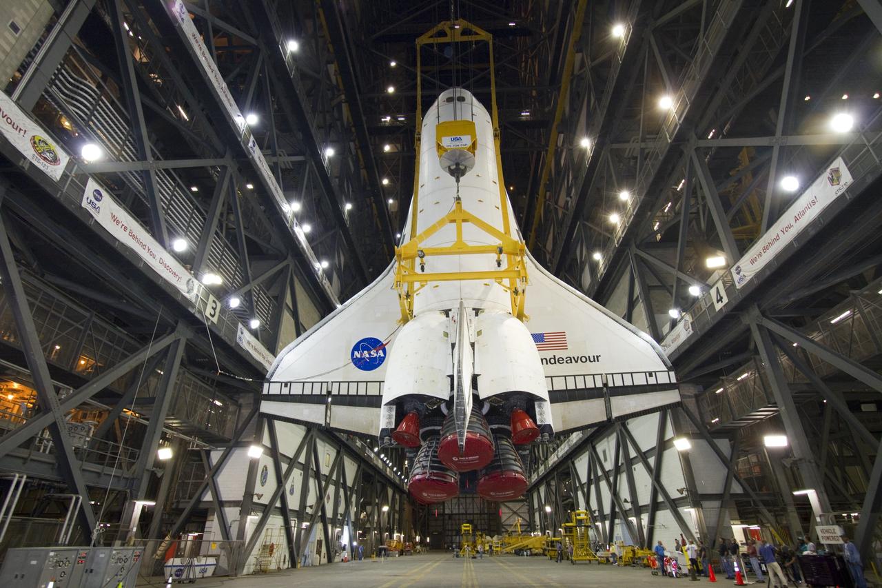 CAPE CANAVERAL, Fla. -- In Vehicle Assembly Building at NASA's Kennedy Space Center in Florida, shuttle Endeavour is suspended vertically over the transfer aisle. The spacecraft will be moved into a high bay where it will be installed to the waiting external fuel tank and solid rocket boosters.            Endeavour and its STS-134 crew will deliver the Express Logistics Carrier-3, Alpha Magnetic Spectrometer, a high-pressure gas tank, additional spare parts for Dextre and micrometeoroid debris shields to the International Space Station. Endeavour's final launch is targeted for April 19 at 7:48 p.m. EDT. For more information visit, http://www.nasa.gov/mission_pages/shuttle/shuttlemissions/sts134/index.html. Photo credit: NASA/Jack Pfaller