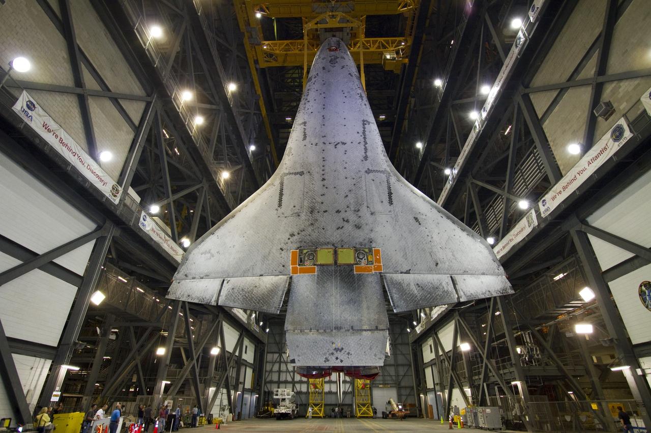 CAPE CANAVERAL, Fla. -- In Vehicle Assembly Building at NASA's Kennedy Space Center in Florida, shuttle Endeavour is suspended vertically over the transfer aisle. The spacecraft will be moved into a high bay where it will be installed to the waiting external fuel tank and solid rocket boosters.            Endeavour and its STS-134 crew will deliver the Express Logistics Carrier-3, Alpha Magnetic Spectrometer, a high-pressure gas tank, additional spare parts for Dextre and micrometeoroid debris shields to the International Space Station. Endeavour's final launch is targeted for April 19 at 7:48 p.m. EDT. For more information visit, http://www.nasa.gov/mission_pages/shuttle/shuttlemissions/sts134/index.html. Photo credit: NASA/Jack Pfaller