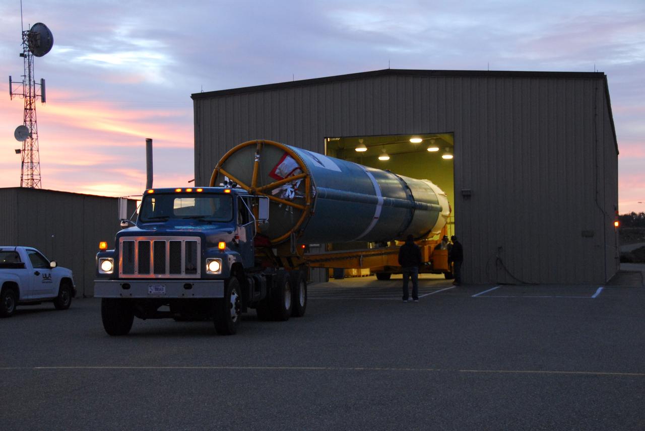 VANDENBERG AIR FORCE BASE, Calif. --  As the sun rises over Vandenberg Air Force Base in California, the first stage of the Delta II rocket that will carry NASA's Aquarius satellite into low Earth orbit is on its way to Space Launch Complex-2 (SLC-2). While the Delta II rocket is stacked on SLC-2, teams for NASA's Glory spacecraft and Orbital Sciences Taurus XL rocket are in launch preparation mode at Vandenberg's nearby Space Launch Complex 576-E.        Scheduled to launch in June, Aquarius' mission will be to provide monthly maps of global changes in sea surface salinity. By measuring ocean salinity from space, Aquarius will provide new insights into how the massive natural exchange of freshwater between the ocean, atmosphere and sea ice influences ocean circulation, weather and climate. Also going up with the satellite are optical and thermal cameras, a microwave radiometer and the SAC-D spacecraft, which were developed with the help of institutions in Italy, France, Canada and Argentina. Photo credit: NASA/VAFB