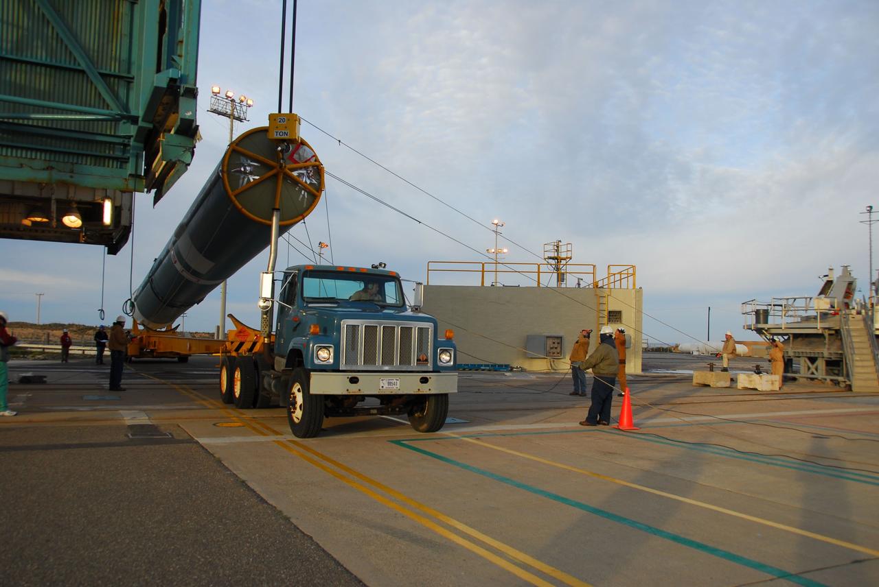 VANDENBERG AIR FORCE BASE, Calif. -- The first stage of the Delta II rocket that will carry NASA's Aquarius satellite into low Earth orbit is raised onto the launch pad at Vandenberg Air Force Base's Space Launch Complex-2 (SLC-2) in California. While the Delta II rocket is stacked on SLC-2, teams for NASA's Glory spacecraft and Orbital Sciences Taurus XL rocket are in launch preparation mode at Vandenberg's nearby Space Launch Complex 576-E.        Scheduled to launch in June, Aquarius' mission will be to provide monthly maps of global changes in sea surface salinity. By measuring ocean salinity from space, Aquarius will provide new insights into how the massive natural exchange of freshwater between the ocean, atmosphere and sea ice influences ocean circulation, weather and climate. Also going up with the satellite are optical and thermal cameras, a microwave radiometer and the SAC-D spacecraft, which were developed with the help of institutions in Italy, France, Canada and Argentina. Photo credit: NASA/VAFB