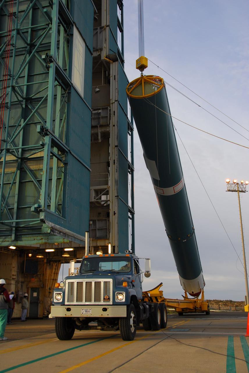 VANDENBERG AIR FORCE BASE, Calif. -- The first stage of the Delta II rocket that will carry NASA's Aquarius satellite into low Earth orbit is raised onto the launch pad at Vandenberg Air Force Base's Space Launch Complex-2 (SLC-2) in California. While the Delta II rocket is stacked on SLC-2, teams for NASA's Glory spacecraft and Orbital Sciences Taurus XL rocket are in launch preparation mode at Vandenberg's nearby Space Launch Complex 576-E.      Scheduled to launch in June, Aquarius' mission will be to provide monthly maps of global changes in sea surface salinity. By measuring ocean salinity from space, Aquarius will provide new insights into how the massive natural exchange of freshwater between the ocean, atmosphere and sea ice influences ocean circulation, weather and climate. Also going up with the satellite are optical and thermal cameras, a microwave radiometer and the SAC-D spacecraft, which were developed with the help of institutions in Italy, France, Canada and Argentina. Photo credit: NASA/VAFB