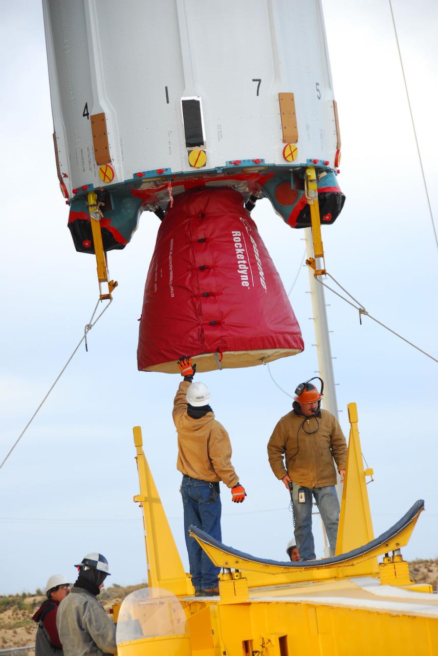 VANDENBERG AIR FORCE BASE, Calif. --  Technicians guide the first stage of the Delta II rocket that will carry NASA's Aquarius satellite into low Earth orbit onto the launch pad at Vandenberg Air Force Base's Space Launch Complex-2 (SLC-2) in California. While the Delta II rocket is stacked on SLC-2, teams for NASA's Glory spacecraft and Orbital Sciences Taurus XL rocket are in launch preparation mode at Vandenberg's nearby Space Launch Complex 576-E.      Scheduled to launch in June, Aquarius' mission will be to provide monthly maps of global changes in sea surface salinity. By measuring ocean salinity from space, Aquarius will provide new insights into how the massive natural exchange of freshwater between the ocean, atmosphere and sea ice influences ocean circulation, weather and climate. Also going up with the satellite are optical and thermal cameras, a microwave radiometer and the SAC-D spacecraft, which were developed with the help of institutions in Italy, France, Canada and Argentina. Photo credit: NASA/VAFB