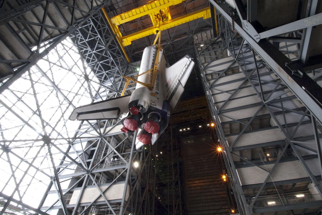 CAPE CANAVERAL, Fla. -- In the Vehicle Assembly Building at NASA's Kennedy Space Center in Florida, shuttle Endeavour is being lifted and moved into a high bay where it will be attached to its external fuel tank and solid rocket boosters, already positioned on the mobile launcher platform. Endeavour and its STS-134 crew will deliver the Express Logistics Carrier-3, Alpha Magnetic Spectrometer, a high-pressure gas tank, additional spare parts for Dextre and micrometeoroid debris shields to the International Space Station. Endeavour's final launch is targeted for April 19 at 7:48 p.m. EDT. For more information visit, http://www.nasa.gov/mission_pages/shuttle/shuttlemissions/sts134/index.html. Photo credit: NASA/Jim Grossmann