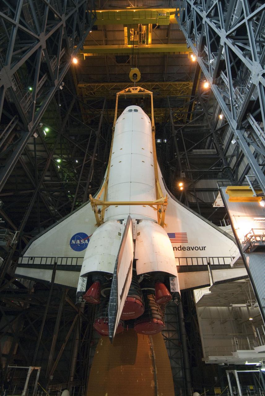 CAPE CANAVERAL, Fla. -- In the Vehicle Assembly Building at NASA's Kennedy Space Center in Florida, shuttle Endeavour is being lowered into place where it will be attached to its external fuel tank and solid rocket boosters, already positioned on the mobile launcher platform. Endeavour and its STS-134 crew will deliver the Express Logistics Carrier-3, Alpha Magnetic Spectrometer, a high-pressure gas tank, additional spare parts for Dextre and micrometeoroid debris shields to the International Space Station. Endeavour's final launch is targeted for April 19 at 7:48 p.m. EDT. For more information visit, http://www.nasa.gov/mission_pages/shuttle/shuttlemissions/sts134/index.html. Photo credit: NASA/Jim Grossmann