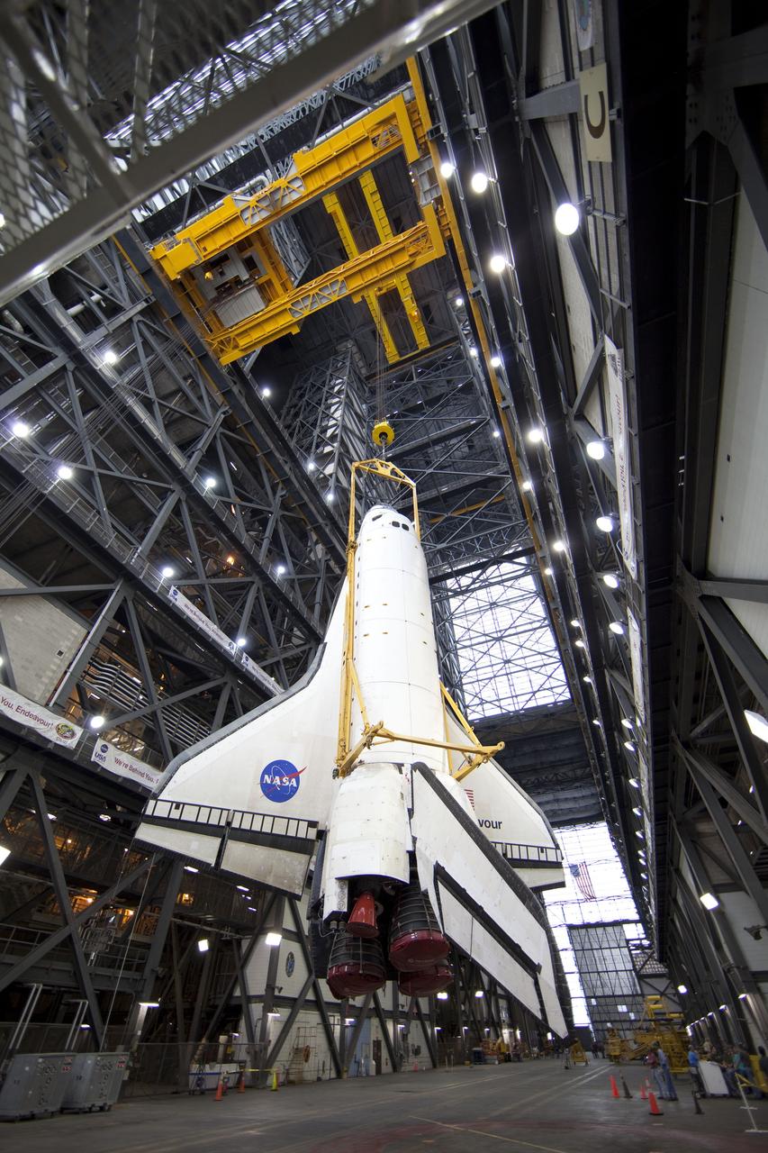 CAPE CANAVERAL, Fla. -- A large yellow, metal sling lifts shuttle Endeavour from the transfer aisle into a high bay of the Vehicle Assembly Building at NASA's Kennedy Space Center in Florida. In the bay, the shuttle will be attached to its external fuel tank and solid rocket boosters. Endeavour is targeted to roll out to Kennedy's Launch Pad 39A for its final mission, STS-134, on March 9. Endeavour and the six-member crew will deliver the Express Logistics Carrier-3, Alpha Magnetic Spectrometer-2 (AMS), a high-pressure gas tank, additional spare parts for the Dextre robotic helper and micrometeoroid debris shields to the International Space Station. Endeavour's final launch is targeted for April 19 at 7:48 p.m. EDT. For more information visit, http://www.nasa.gov/mission_pages/shuttle/shuttlemissions/sts134/index.html. Photo credit: NASA/Frankie Martin