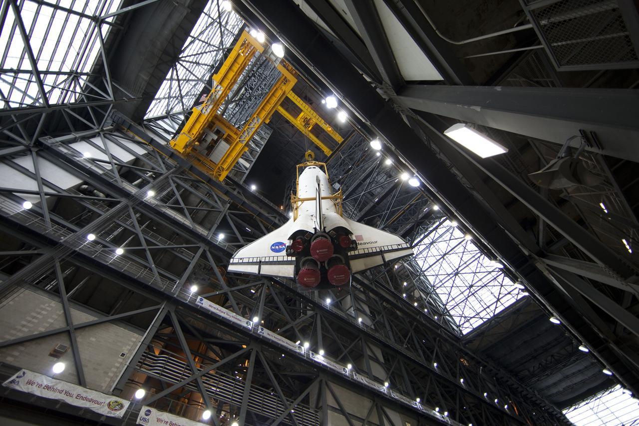 CAPE CANAVERAL, Fla. -- A large yellow, metal sling lifts shuttle Endeavour from the transfer aisle into a high bay of the Vehicle Assembly Building at NASA's Kennedy Space Center in Florida. In the bay, the shuttle will be attached to its external fuel tank and solid rocket boosters. Endeavour is targeted to roll out to Kennedy's Launch Pad 39A for its final mission, STS-134, on March 9. Endeavour and the six-member crew will deliver the Express Logistics Carrier-3, Alpha Magnetic Spectrometer-2 (AMS), a high-pressure gas tank, additional spare parts for the Dextre robotic helper and micrometeoroid debris shields to the International Space Station. Endeavour's final launch is targeted for April 19 at 7:48 p.m. EDT. For more information visit, http://www.nasa.gov/mission_pages/shuttle/shuttlemissions/sts134/index.html. Photo credit: NASA/Frankie Martin