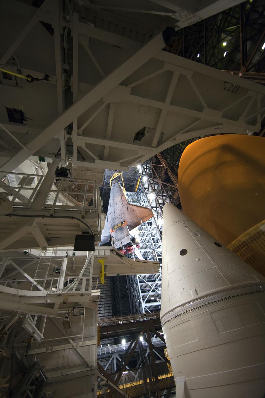 CAPE CANAVERAL, Fla. -- A large yellow, metal sling lifts shuttle Endeavour from the transfer aisle into a high bay of the Vehicle Assembly Building at NASA's Kennedy Space Center in Florida. In the bay, the shuttle will be attached to its external fuel tank and solid rocket boosters. Endeavour is targeted to roll out to Kennedy's Launch Pad 39A for its final mission, STS-134, on March 9. Endeavour and the six-member crew will deliver the Express Logistics Carrier-3, Alpha Magnetic Spectrometer-2 (AMS), a high-pressure gas tank, additional spare parts for the Dextre robotic helper and micrometeoroid debris shields to the International Space Station. Endeavour's final launch is targeted for April 19 at 7:48 p.m. EDT. For more information visit, http://www.nasa.gov/mission_pages/shuttle/shuttlemissions/sts134/index.html. Photo credit: NASA/Frankie Martin