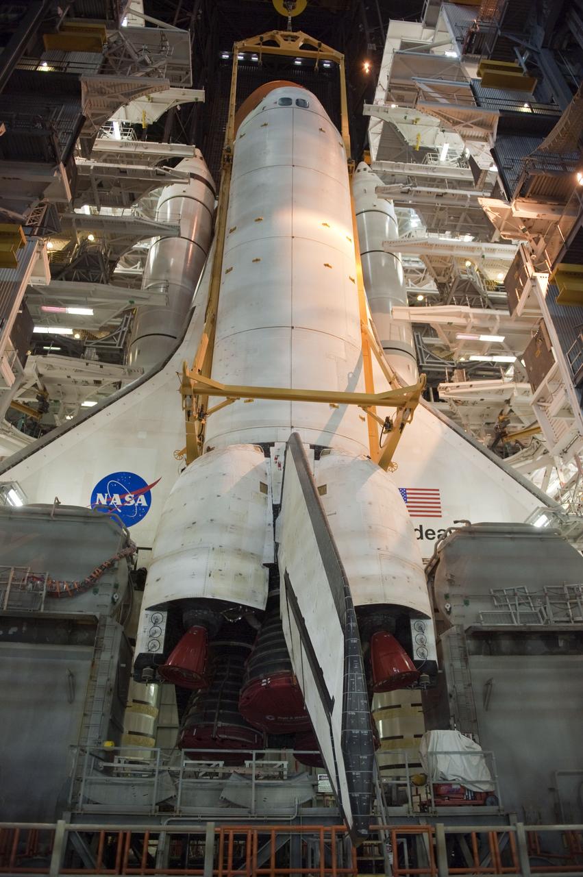 CAPE CANAVERAL, Fla. -- In the Vehicle Assembly Building at NASA's Kennedy Space Center in Florida, shuttle Endeavour is lowered into place where it is being attached to its external fuel tank and solid rocket boosters, already positioned on the mobile launcher platform. Endeavour and its STS-134 crew will deliver the Express Logistics Carrier-3, Alpha Magnetic Spectrometer, a high-pressure gas tank, additional spare parts for Dextre and micrometeoroid debris shields to the International Space Station. Endeavour's final launch is targeted for April 19 at 7:48 p.m. EDT. For more information visit, http://www.nasa.gov/mission_pages/shuttle/shuttlemissions/sts134/index.html. Photo credit: NASA/Kim Shiflett
