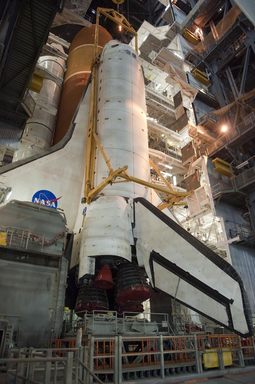 CAPE CANAVERAL, Fla. -- In the Vehicle Assembly Building at NASA's Kennedy Space Center in Florida, shuttle Endeavour is lowered into place where it is being attached to its external fuel tank and solid rocket boosters, already positioned on the mobile launcher platform. Endeavour and its STS-134 crew will deliver the Express Logistics Carrier-3, Alpha Magnetic Spectrometer, a high-pressure gas tank, additional spare parts for Dextre and micrometeoroid debris shields to the International Space Station. Endeavour's final launch is targeted for April 19 at 7:48 p.m. EDT. For more information visit, http://www.nasa.gov/mission_pages/shuttle/shuttlemissions/sts134/index.html. Photo credit: NASA/Kim Shiflett