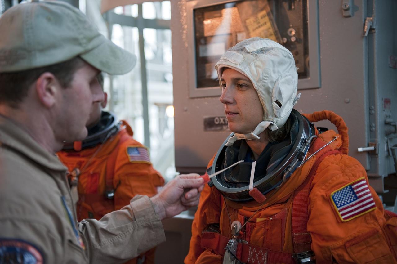 CAPE CANAVERAL, Fla. – An emergency exit, or Mode II/IV, exercise is under way at the 195-foot level of Launch Pad 39A at NASA's Kennedy Space Center in Florida. The exercise involves NASA fire rescue personnel, volunteers portraying astronauts with simulated injuries, helicopters and personnel from the Air Force’s 920th Rescue Wing, and medical trauma teams at three Central Florida hospitals. The drill allows teams to practice an emergency response at the launch pad, including helicopter evacuation to local hospitals.                         Photo credit: NASA/Kim Shiflett