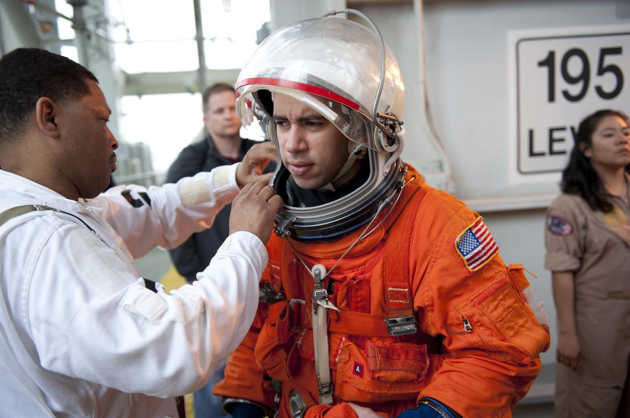 CAPE CANAVERAL, Fla. – An emergency exit, or Mode II/IV, exercise is under way at the 195-foot level of Launch Pad 39A at NASA's Kennedy Space Center in Florida. The exercise involves NASA fire rescue personnel, volunteers portraying astronauts with simulated injuries, helicopters and personnel from the Air Force’s 920th Rescue Wing, and medical trauma teams at three Central Florida hospitals. The drill allows teams to practice an emergency response at the launch pad, including helicopter evacuation to local hospitals.                       Photo credit: NASA/Kim Shiflett