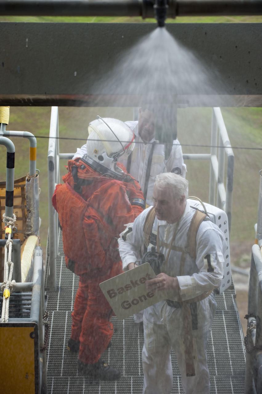 CAPE CANAVERAL, Fla. – An emergency exit, or Mode II/IV, exercise is under way at the slidewire basket area of Launch Pad 39A at NASA's Kennedy Space Center in Florida. The exercise involves NASA fire rescue personnel, volunteers portraying astronauts with simulated injuries, helicopters and personnel from the Air Force’s 920th Rescue Wing, and medical trauma teams at three Central Florida hospitals. The drill allows teams to practice an emergency response at the launch pad, including helicopter evacuation to local hospitals.                 Photo credit: NASA/Kim Shiflett