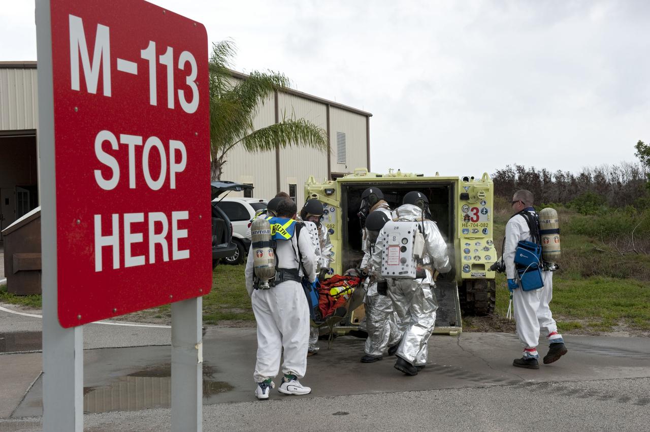 CAPE CANAVERAL, Fla. – An emergency exit, or Mode II/IV, exercise is under way near Launch Pad 39A at NASA's Kennedy Space Center in Florida. The exercise involves NASA fire rescue personnel, volunteers portraying astronauts with simulated injuries, helicopters and personnel from the Air Force’s 920th Rescue Wing, and medical trauma teams at three Central Florida hospitals. The drill allows teams to practice an emergency response at the launch pad, including helicopter evacuation to local hospitals.         Photo credit: NASA/Kim Shiflett