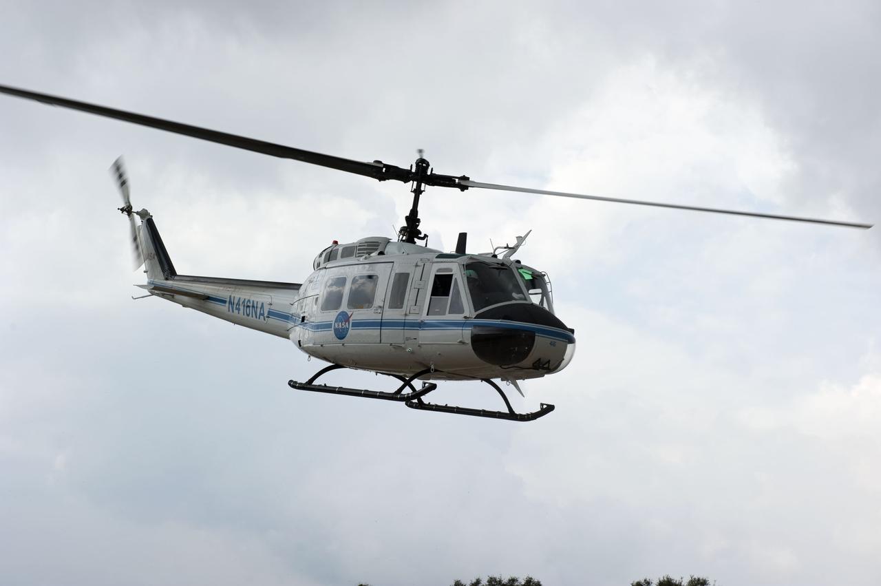 CAPE CANAVERAL, Fla. – A helicopter takes part in an emergency exit, or Mode II/IV, exercise that allows teams to practice an emergency response at Launch Pad 39A at NASA's Kennedy Space Center in Florida. The exercise involves NASA fire rescue personnel, volunteers portraying astronauts with simulated injuries, helicopters and personnel from the Air Force’s 920th Rescue Wing, and medical trauma teams at three Central Florida hospitals. The drill allows teams to practice an emergency response at the launch pad, including helicopter evacuation to local hospitals.     Photo credit: NASA/Kim Shiflett