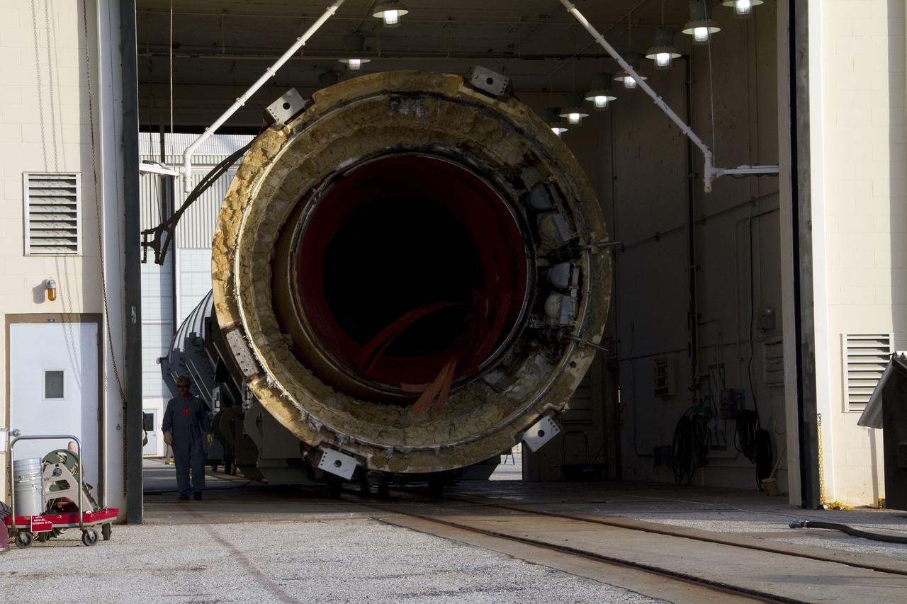 CAPE CANAVERAL, Fla. -- A spent shuttle solid rocket booster undergoes its first cleaning in Hangar AF at Cape Canaveral Air Force Station in Florida. The booster was used during space shuttle Discovery's STS-133 launch from NASA Kennedy Space Center's Launch Pad 39A on Feb. 24. The shuttle’s two solid rocket booster casings and associated flight hardware were recovered in the Atlantic Ocean by retrieval ships Liberty Star and Freedom Star. The boosters impact the Atlantic about seven minutes after liftoff and the retrieval ships are stationed about 10 miles from the impact area at the time of splashdown. After the spent segments are processed, they will be transported to Utah, where they will be refurbished and stored, if needed. Photo credit: NASA/Jack Pfaller
