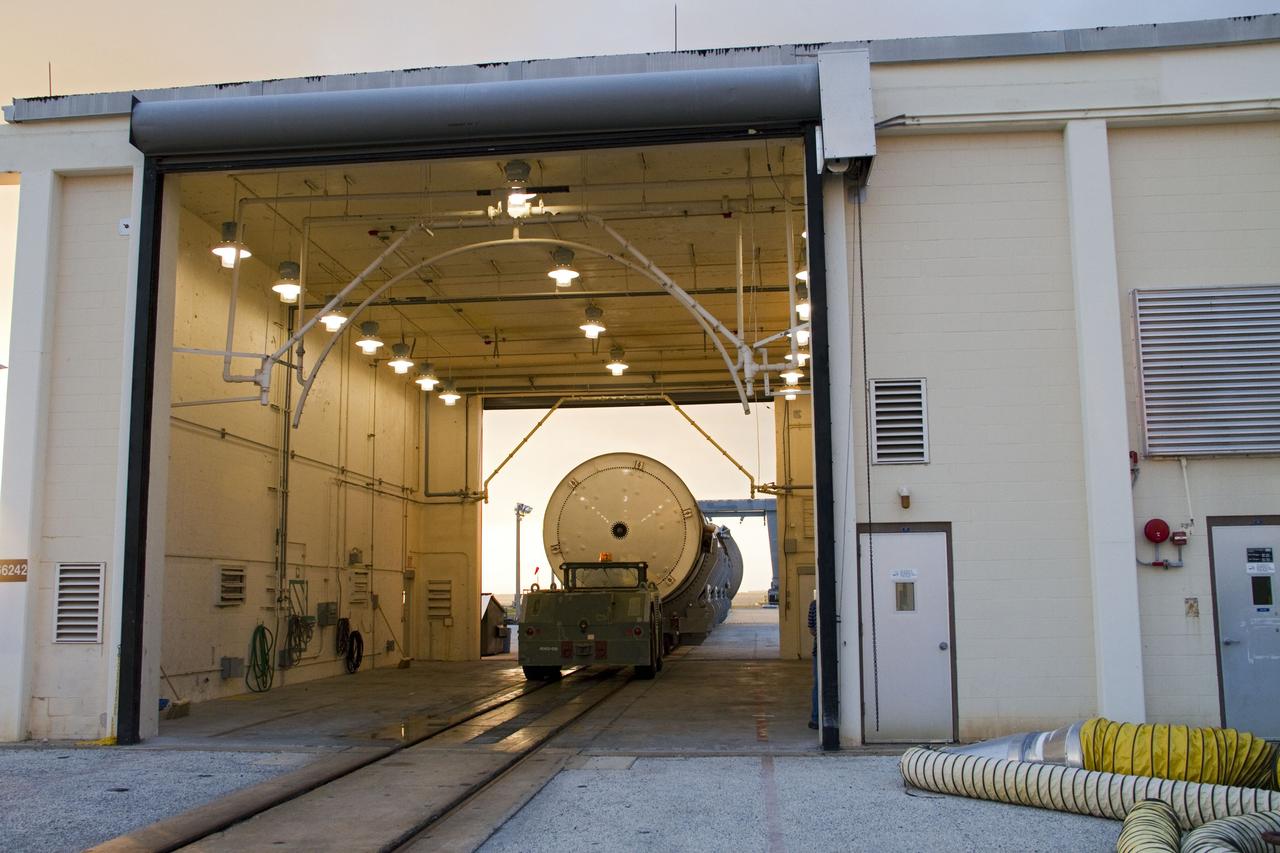 CAPE CANAVERAL, Fla. -- A spent shuttle solid rocket booster undergoes its first cleaning in Hangar AF at Cape Canaveral Air Force Station in Florida. The booster was used during space shuttle Discovery's STS-133 launch from NASA Kennedy Space Center's Launch Pad 39A on Feb. 24. The shuttle’s two solid rocket booster casings and associated flight hardware were recovered in the Atlantic Ocean by retrieval ships Liberty Star and Freedom Star.        The boosters impact the Atlantic about seven minutes after liftoff and the retrieval ships are stationed about 10 miles from the impact area at the time of splashdown.  After the spent segments are processed, they will be transported to Utah, where they will be refurbished and stored, if needed. Photo credit: NASA/Jack Pfaller