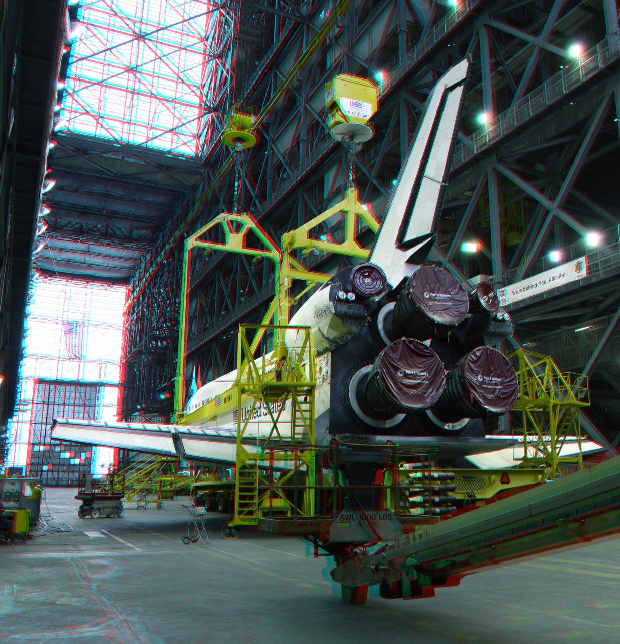 CAPE CANAVERAL, Fla. -- This is a 3-D image of space shuttle Endeavour as it is outfitted with a metal sling that will lift the spacecraft from the transfer aisle into a high bay of the Vehicle Assembly Building at NASA's Kennedy Space Center in Florida. In the bay, the shuttle will be attached to its external fuel tank and solid rocket boosters. Endeavour is targeted to roll out to Kennedy's Launch Pad 39A for its final mission, STS-134, on March 9. To view this image, use green and magenta 3-D glasses. Endeavour and six-member crew will deliver the Express Logistics Carrier-3, Alpha Magnetic Spectrometer-2 (AMS), a high-pressure gas tank, additional spare parts for the Dextre robotic helper and micrometeoroid debris shields to the International Space Station. Endeavour's final launch is targeted for April 19 at 7:48 p.m. EDT. For more information visit, http://www.nasa.gov/mission_pages/shuttle/shuttlemissions/sts134/index.html. Photo credit: NASA/Frankie Martin
