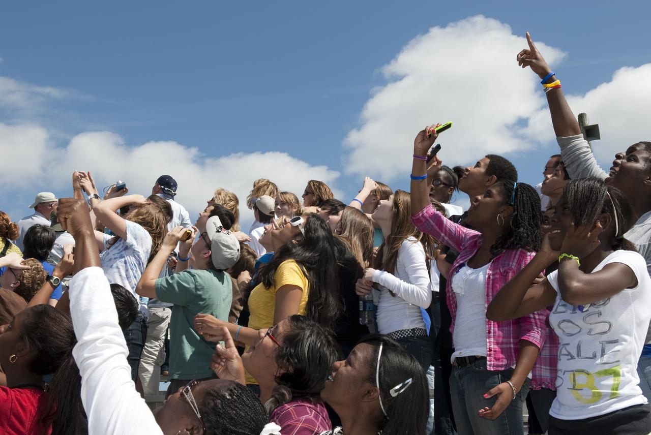 CAPE CANAVERAL, Fla. -- At NASA's Kennedy Space Center in Florida, about 50 eighth-grade students from McNair Magnet Middle School in Rockledge, Fla., and other invited guests watch shuttle Discovery return from space for the last time. Discovery touched down on the Shuttle Landing Facility's Runway 15 at 11:57 a.m. EST, completing the 13-day STS-133 mission to the International Space Station. Discovery and its six-member crew delivered the Permanent Multipurpose Module, packed with supplies and critical spare parts, as well as Robonaut 2, the dexterous humanoid astronaut helper, to the orbiting outpost. STS-133 was Discovery's 39th and final mission. This was the 133rd Space Shuttle Program mission and the 35th shuttle voyage to the space station. Photo credit: NASA/Jim Grossmann