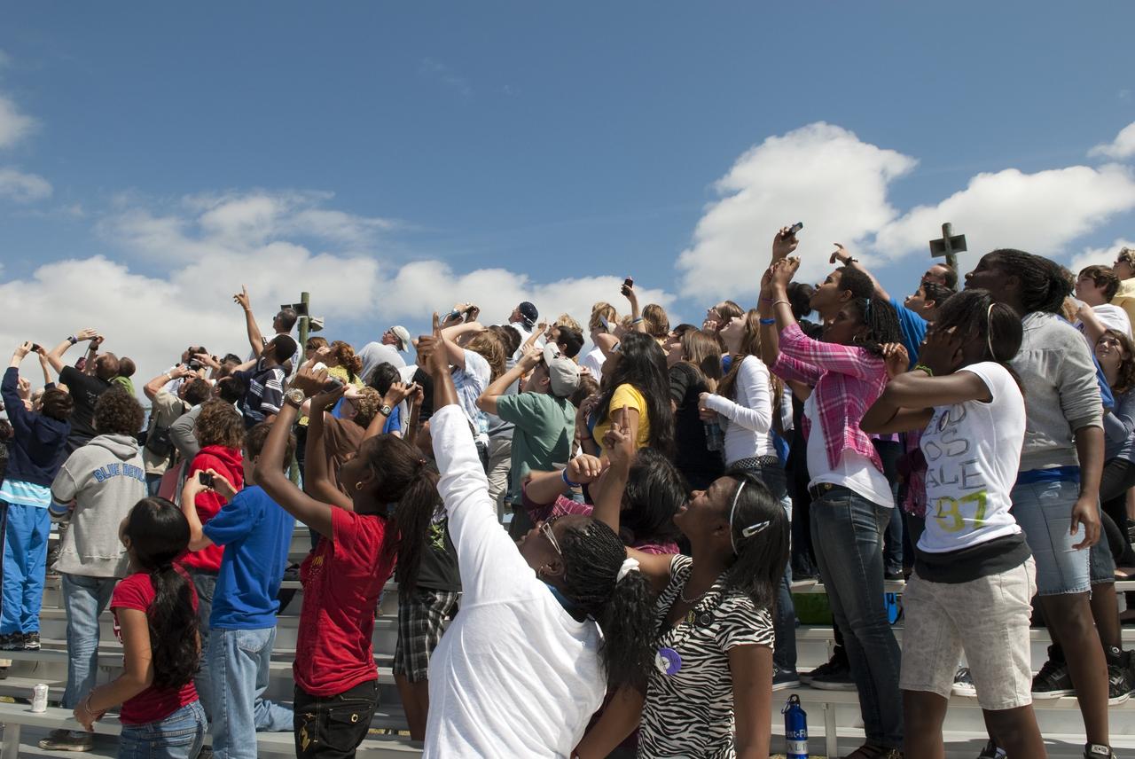 CAPE CANAVERAL, Fla. -- At NASA's Kennedy Space Center in Florida, about 50 eighth-grade students from McNair Magnet Middle School in Rockledge, Fla., and other invited guests watch shuttle Discovery return from space for the last time. Discovery touched down on the Shuttle Landing Facility's Runway 15 at 11:57 a.m. EST, completing the 13-day STS-133 mission to the International Space Station.            Discovery and its six-member crew delivered the Permanent Multipurpose Module, packed with supplies and critical spare parts, as well as Robonaut 2, the dexterous humanoid astronaut helper, to the orbiting outpost. STS-133 was Discovery's 39th and final mission. This was the 133rd Space Shuttle Program mission and the 35th shuttle voyage to the space station. Photo credit: NASA/Jim Grossmann