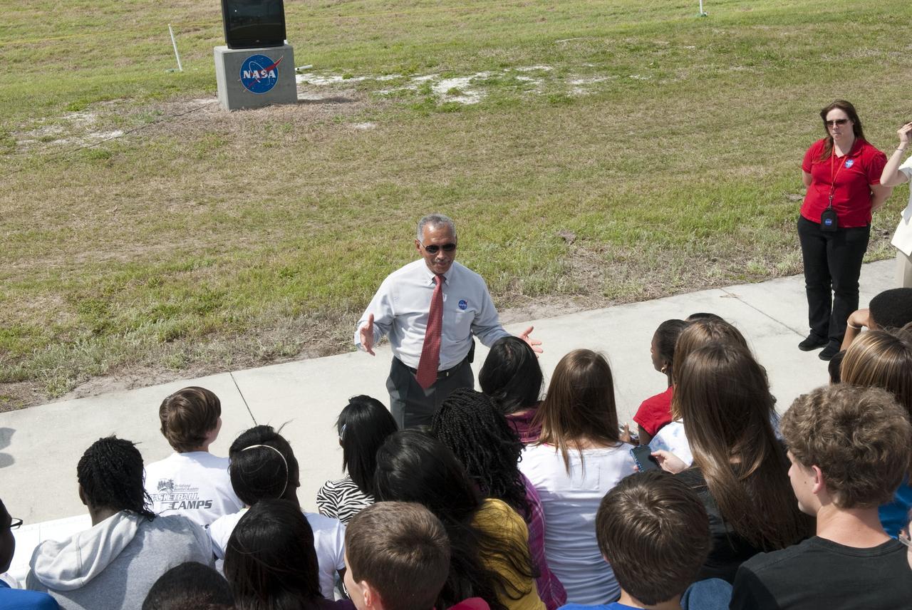 CAPE CANAVERAL, Fla. -- NASA Administrator Charlie Bolden talks to about 50 eighth-grade students from McNair Magnet Middle School in Rockledge, Fla., and other invited guests who are at Kennedy Space Center in Florida to watch shuttle Discovery return from space for the last time. Discovery touched down on the Shuttle Landing Facility's Runway 15 at 11:57 a.m. EST, completing the 13-day STS-133 mission to the International Space Station.          Discovery and its six-member crew delivered the Permanent Multipurpose Module, packed with supplies and critical spare parts, as well as Robonaut 2, the dexterous humanoid astronaut helper, to the orbiting outpost. STS-133 was Discovery's 39th and final mission. This was the 133rd Space Shuttle Program mission and the 35th shuttle voyage to the space station. Photo credit: NASA/Jim Grossmann