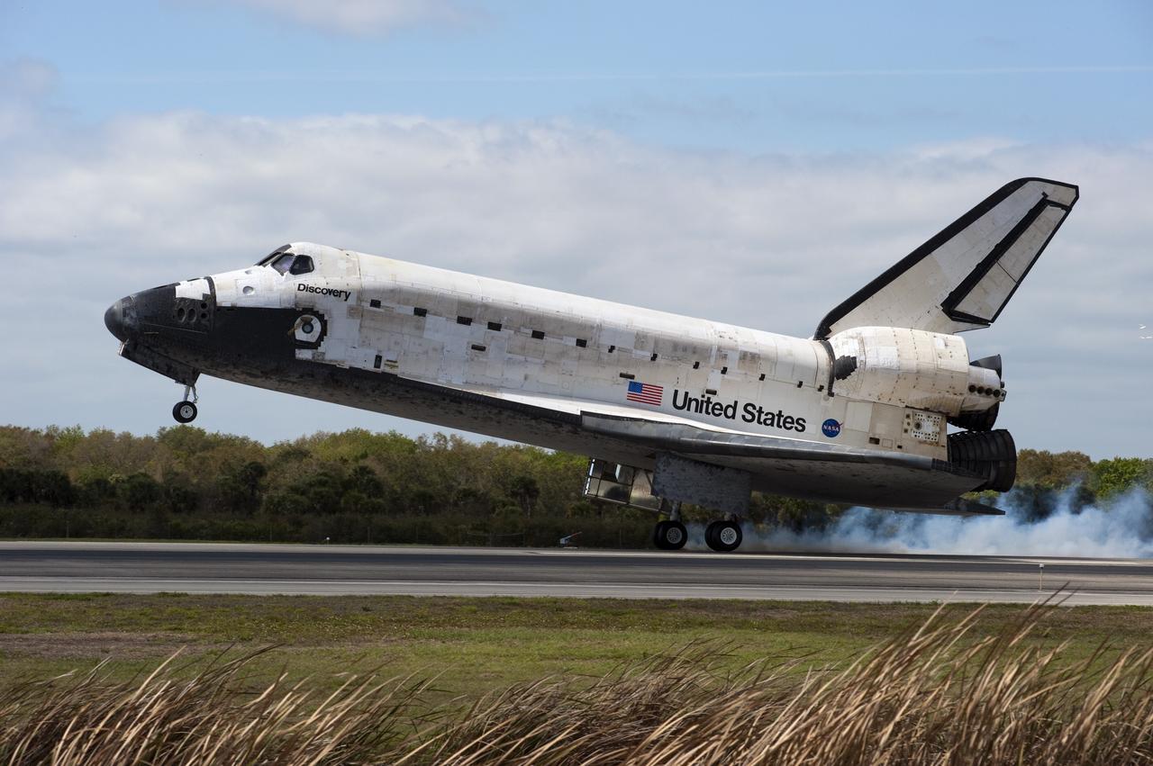 CAPE CANAVERAL, Fla. -- Streams of smoke trail from the main landing gear tires as space shuttle Discovery touches down on Runway 15 at the Shuttle Landing Facility at NASA's Kennedy Space Center in Florida after 13-days in space, completing the 5.3-million-mile STS-133 mission. Main gear touchdown was at 11:57:17 a.m., followed by nose gear touchdown at 11:57:28, and wheelstop at 11:58:14 a.m. On board are Commander Steve Lindsey, Pilot Eric Boe, and Mission Specialists Nicole Stott, Michael Barratt, Alvin Drew and Steve Bowen.            Discovery and its six-member crew delivered the Permanent Multipurpose Module, packed with supplies and critical spare parts, as well as Robonaut 2, the dexterous humanoid astronaut helper, to the orbiting outpost. STS-133 was Discovery's 39th and final mission. This was the 133rd Space Shuttle Program mission and the 35th shuttle voyage to the space station. Photo credit: NASA/Ben Cooper