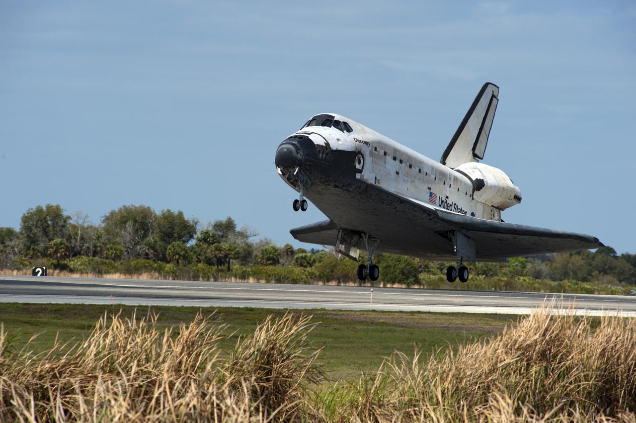 CAPE CANAVERAL, Fla. -- Space shuttle Discovery glides above Runway 15 before touching down at the Shuttle Landing Facility at NASA's Kennedy Space Center in Florida. Landing was at 11:57 a.m. EST, completing the 13-day STS-133 mission to the International Space Station. Main gear touchdown was at 11:57:17 a.m., followed by nose gear touchdown at 11:57:28, and wheelstop at 11:58:14 a.m. On board are Commander Steve Lindsey, Pilot Eric Boe, and Mission Specialists Nicole Stott, Michael Barratt, Alvin Drew and Steve Bowen. Discovery and its six-member crew delivered the Permanent Multipurpose Module, packed with supplies and critical spare parts, as well as Robonaut 2, the dexterous humanoid astronaut helper, to the orbiting outpost. STS-133 was Discovery's 39th and final mission. This was the 133rd Space Shuttle Program mission and the 35th shuttle voyage to the space station. Photo credit: NASA/Chad Baumer