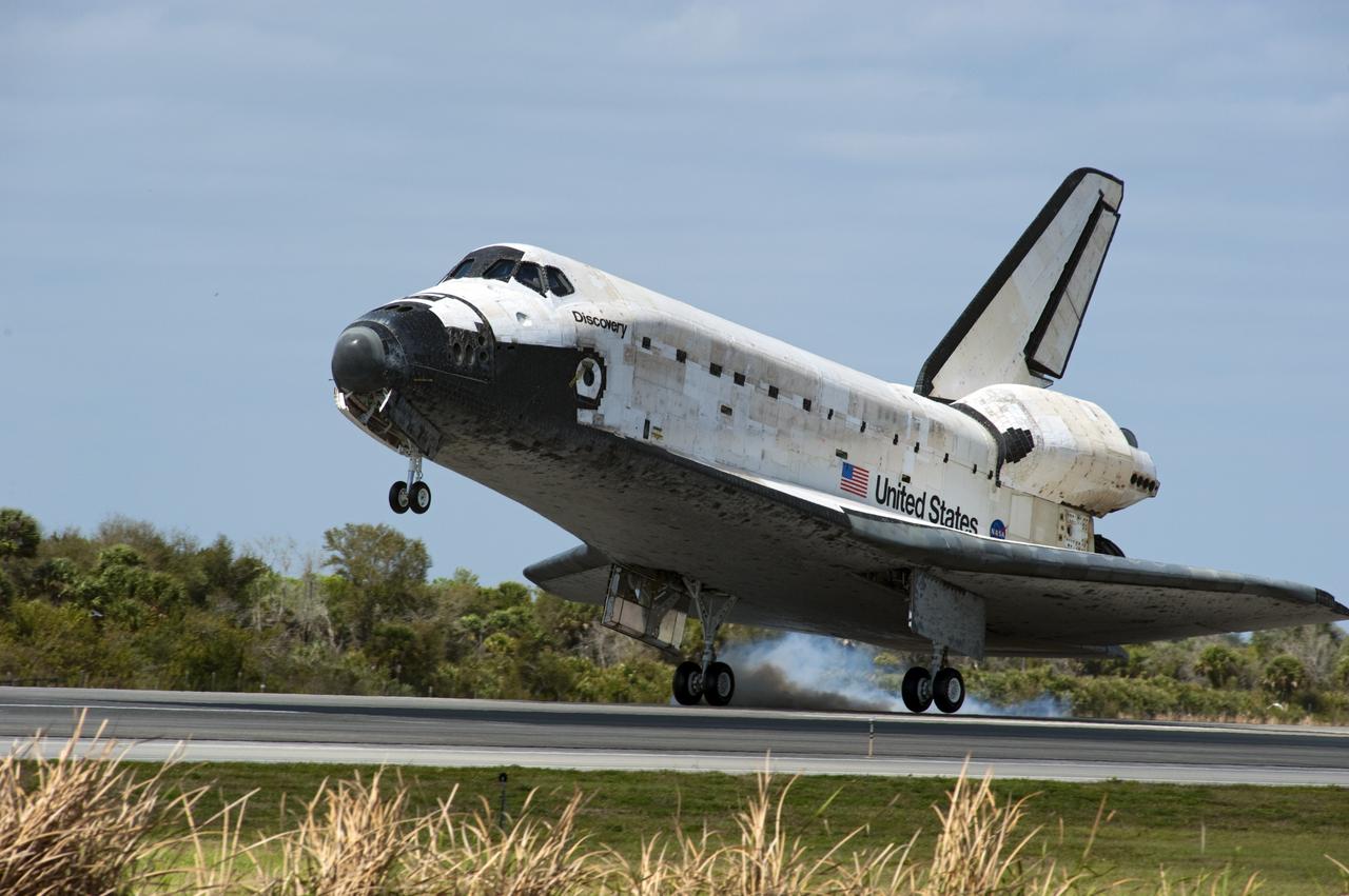 CAPE CANAVERAL, Fla. -- Streams of smoke trail from the main landing gear tires as space shuttle Discovery touches down on Runway 15 at the Shuttle Landing Facility at NASA's Kennedy Space Center in Florida. Landing was at 11:57 a.m. EST, completing the 13-day STS-133 mission to the International Space Station. Main gear touchdown was at 11:57:17 a.m., followed by nose gear touchdown at 11:57:28, and wheelstop at 11:58:14 a.m. On board are Commander Steve Lindsey, Pilot Eric Boe, and Mission Specialists Nicole Stott, Michael Barratt, Alvin Drew and Steve Bowen. Discovery and its six-member crew delivered the Permanent Multipurpose Module, packed with supplies and critical spare parts, as well as Robonaut 2, the dexterous humanoid astronaut helper, to the orbiting outpost. STS-133 was Discovery's 39th and final mission. This was the 133rd Space Shuttle Program mission and the 35th shuttle voyage to the space station. Photo credit: NASA/Chad Baumer