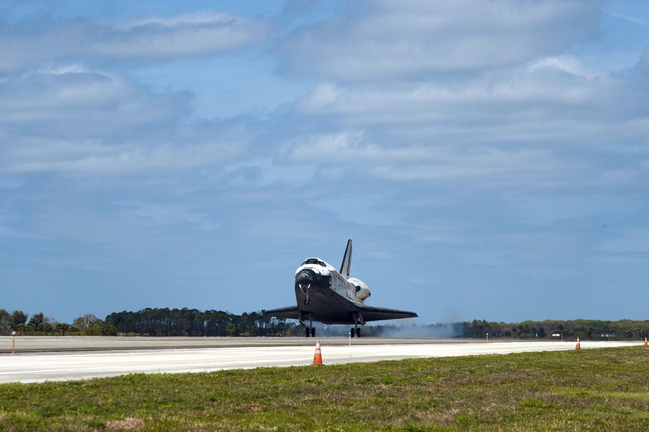 CAPE CANAVERAL, Fla. - Space shuttle Discovery closes its 39-mission career with touch down on Runway 15 at the Shuttle Landing Facility at NASA's Kennedy Space Center in Florida. Discovery's final return from space completed the 13-day, 5.3-million-mile STS-133 mission. Main gear touchdown was at 11:57:17 a.m., followed by nose gear touchdown at 11:57:28, and wheelstop at 11:58:14 a.m. On board are Commander Steve Lindsey, Pilot Eric Boe, and Mission Specialists Nicole Stott, Michael Barratt, Alvin Drew and Steve Bowen.    Discovery and its six-member crew delivered the Permanent Multipurpose Module, packed with supplies and critical spare parts, as well as Robonaut 2, the dexterous humanoid astronaut helper, to the orbiting outpost. This was the 133rd Space Shuttle Program mission and the 35th shuttle voyage to the space station. Photo credit: NASA/Sandra Joseph and Kevin O'Connell