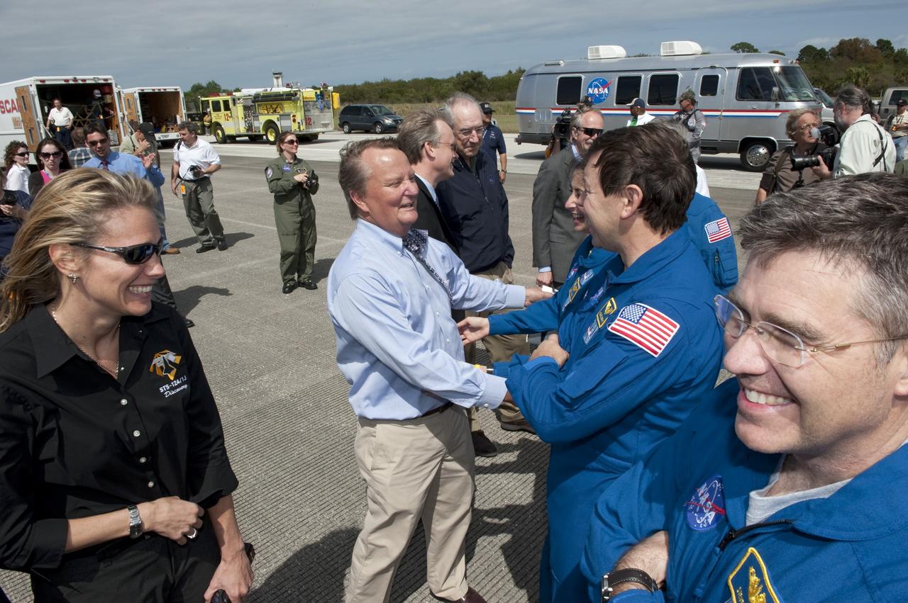 CAPE CANAVERAL, Fla. -- NASA managers welcome space shuttle Discovery's STS-133 crew members home to Kennedy Space Center in Florida. Discovery and its six-member crew landed on the Shuttle Landing Facility's Runway 15 at 11:57 a.m. EST, bringing an end to the 13-day, 5.3-million-mile mission to the International Space Station.    STS-133 delivered the Permanent Multipurpose Module, packed with supplies and critical spare parts, as well as Robonaut 2, the dexterous humanoid astronaut helper, to the orbiting outpost. STS-133 was Discovery's 39th and final mission. This was the 133rd Space Shuttle Program mission and the 35th shuttle voyage to the space station. Photo credit: NASA/Kim Shiflett