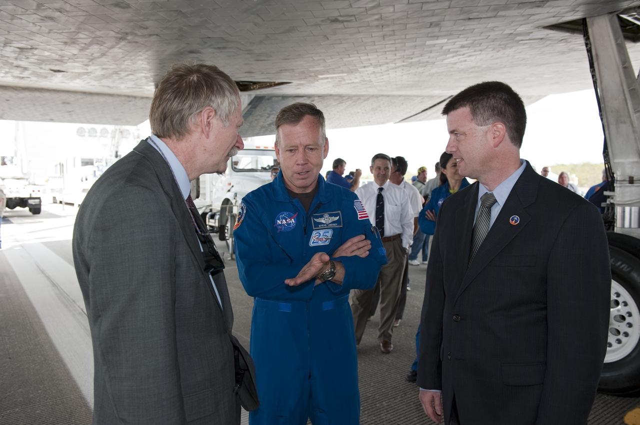 CAPE CANAVERAL, Fla. -- Associate Administrator for Space Operations Bill Gerstenmaier, left, STS-133 Commander Steve Lindsey and Space Shuttle Launch Integration Manager Mike Moses talk about Lindsey's recent 13-day, 5.3-million-mile mission to the International Space Station aboard space shuttle Discovery. The STS-133 crew returned to Earth at 11:57 a.m. on the Shuttle Landing Facility's Runway 15 at NASA's Kennedy Space Center in Florida.    STS-133 delivered the Permanent Multipurpose Module, packed with supplies and critical spare parts, as well as Robonaut 2, the dexterous humanoid astronaut helper, to the orbiting outpost. STS-133 was Discovery's 39th and final mission. This was the 133rd Space Shuttle Program mission and the 35th shuttle voyage to the space station. Photo credit: NASA/Kim Shiflett
