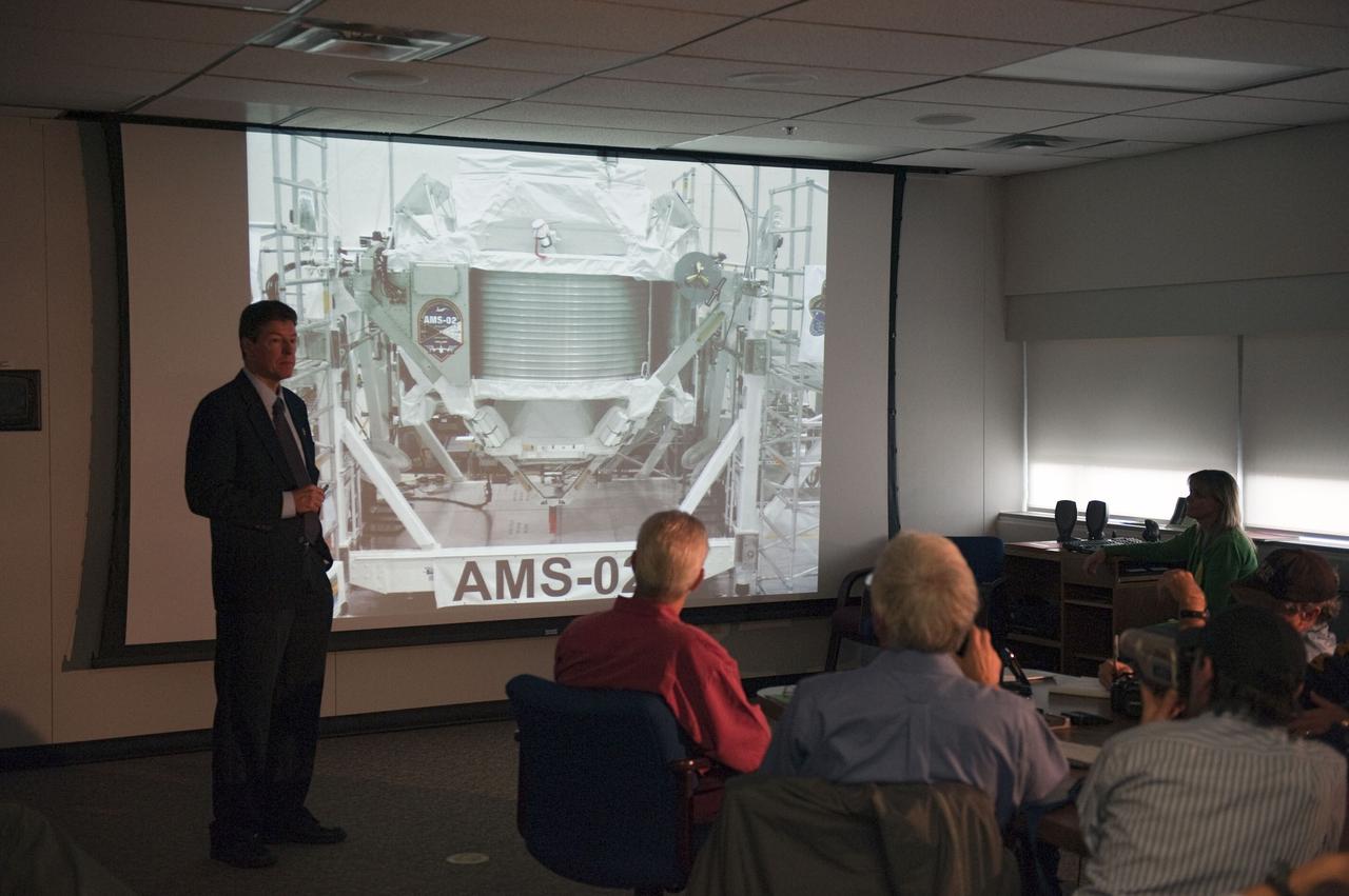 CAPE CANAVERAL, Fla. -- In the Space Station Processing Facility's conference room at NASA's Kennedy Space Center in Florida, Ken Bollweg, Alpha Magnetic Spectrometer-2 (AMS) deputy project manager, talks to media about the particle physics detector. AMS is designed to operate as an external experiment on the International Space Station. It will use the unique environment of space to study the universe and its origin by searching for dark matter.           AMS-2 will fly to the station aboard space shuttle Endeavour's STS-134 mission targeted to launch April 19 at 7:48 p.m. EDT. For more information visit, www.nasa.gov/mission_pages/shuttle/shuttlemissions/sts134/index.html. Photo credit: NASA/Glenn Benson