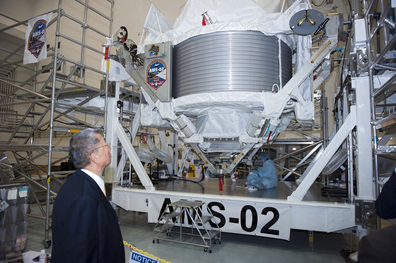 CAPE CANAVERAL, Fla. -- In the Space Station Processing Facility at NASA's Kennedy Space Center in Florida, Professor Sam Ting, Alpha Magnetic Spectrometer-2 (AMS) principal investigator at the Massachusetts Institute of Technology, checks out the particle physics detector. AMS is designed to operate as an external experiment on the International Space Station. It will use the unique environment of space to study the universe and its origin by searching for dark matter.             AMS-2 will fly to the station aboard space shuttle Endeavour's STS-134 mission targeted to launch April 19 at 7:48 p.m. EDT. For more information visit, www.nasa.gov/mission_pages/shuttle/shuttlemissions/sts134/index.html. Photo credit: NASA/Glenn Benson
