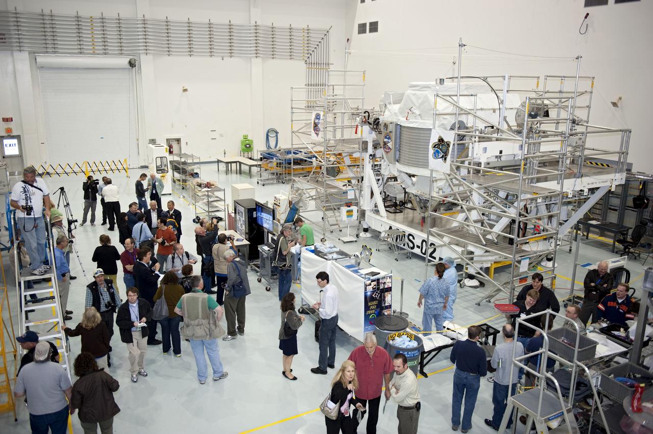 CAPE CANAVERAL, Fla. -- In the Space Station Processing Facility at NASA's Kennedy Space Center in Florida, media check out the Alpha Magnetic Spectrometer-2 (AMS). AMS is a particle physics detector, designed to operate as an external experiment on the International Space Station. It will use the unique environment of space to study the universe and its origin by searching for dark matter.           AMS-2 will fly to the station aboard space shuttle Endeavour's STS-134 mission targeted to launch April 19 at 7:48 p.m. EDT. For more information visit, www.nasa.gov/mission_pages/shuttle/shuttlemissions/sts134/index.html. Photo credit: NASA/Glenn Benson