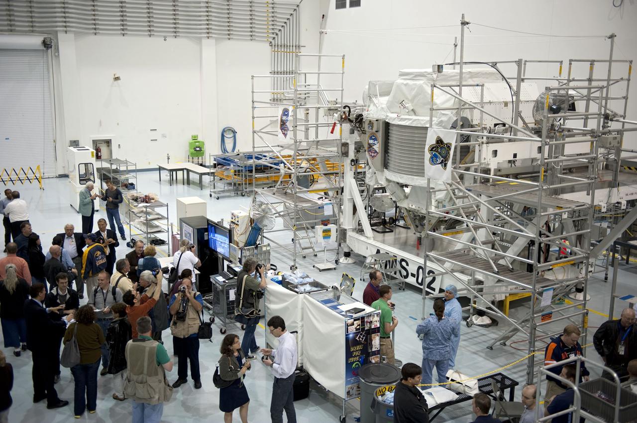 CAPE CANAVERAL, Fla. -- In the Space Station Processing Facility at NASA's Kennedy Space Center in Florida, media check out the Alpha Magnetic Spectrometer-2 (AMS). AMS is a particle physics detector, designed to operate as an external experiment on the International Space Station. It will use the unique environment of space to study the universe and its origin by searching for dark matter.           AMS-2 will fly to the station aboard space shuttle Endeavour's STS-134 mission targeted to launch April 19 at 7:48 p.m. EDT. For more information visit, www.nasa.gov/mission_pages/shuttle/shuttlemissions/sts134/index.html. Photo credit: NASA/Glenn Benson