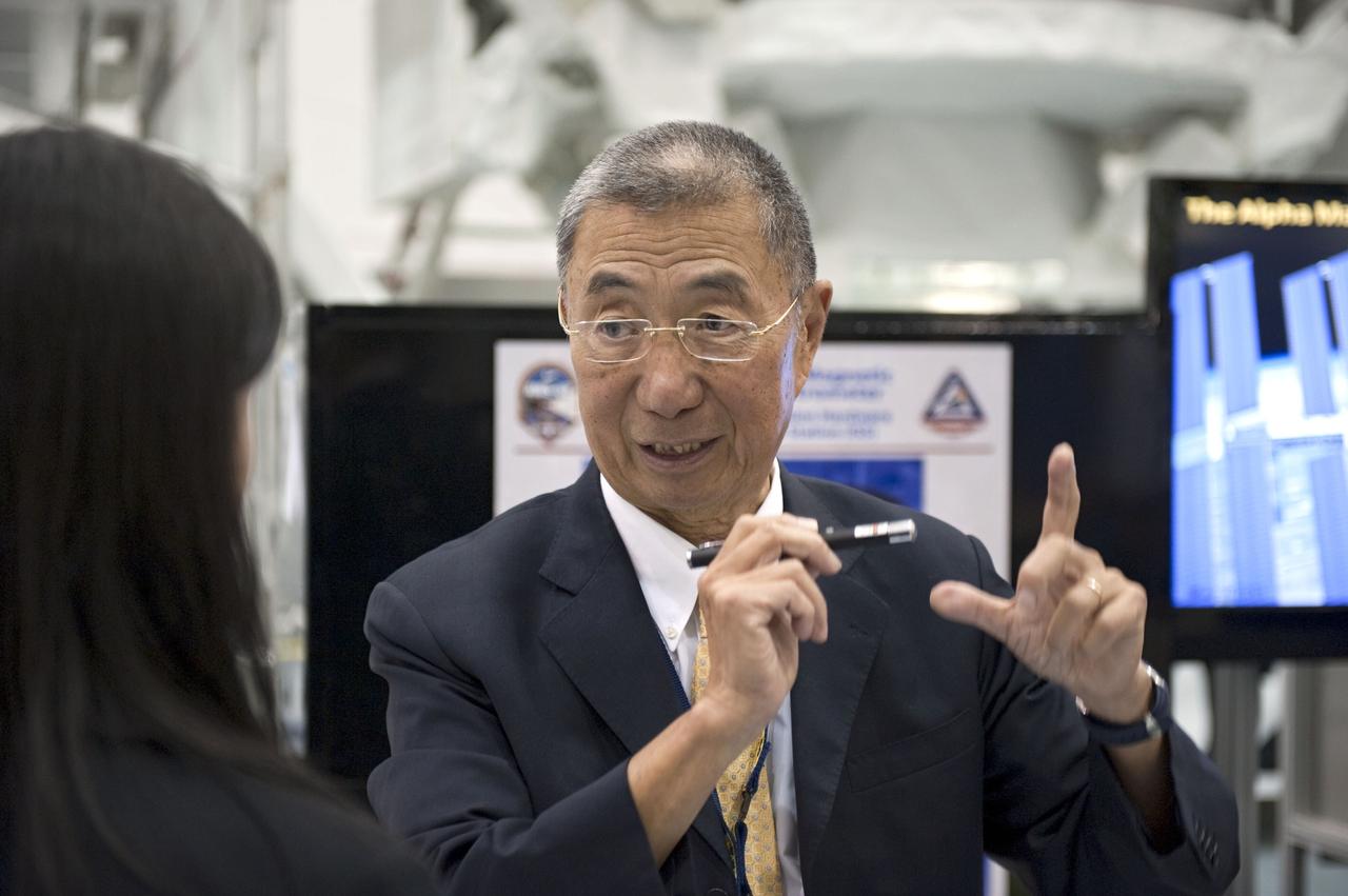 CAPE CANAVERAL, Fla. -- In the Space Station Processing Facility at NASA's Kennedy Space Center in Florida Professor Sam Ting, Alpha Magnetic Spectrometer-2 (AMS) principal investigator at the Massachusetts Institute of Technology, talks to media about the particle physics detector. AMS is designed to operate as an external experiment on the International Space Station. It will use the unique environment of space to study the universe and its origin by searching for dark matter.         AMS-2 will fly to the station aboard space shuttle Endeavour's STS-134 mission targeted to launch April 19 at 7:48 p.m. EDT. For more information visit, www.nasa.gov/mission_pages/shuttle/shuttlemissions/sts134/index.html. Photo credit: NASA/Glenn Benson
