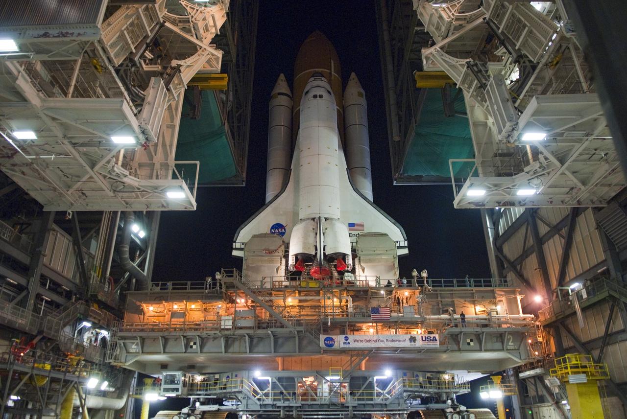 CAPE CANAVERAL, Fla. -- Space shuttle Endeavour begins its slow move from High Bay 3 in the Vehicle Assembly Building to Launch Pad 39A at NASA's Kennedy Space Center in Florida at 7:56 p.m. EST. The 3.4-mile trek, known as "rollout," will take about seven hours to complete. This is the final scheduled rollout for Endeavour, which is attached to its external fuel tank and solid rocket boosters atop a crawler-transporter. Endeavour and its six STS-134 crew members will deliver the Express Logistics Carrier-3, Alpha Magnetic Spectrometer-2 (AMS), a high-pressure gas tank, additional spare parts for the Dextre robotic helper and micrometeoroid debris shields to the International Space Station on the shuttle's final spaceflight. Launch is targeted for April 19 at 7:48 p.m. EDT. For more information visit, www.nasa.gov/mission_pages/shuttle/shuttlemissions/sts134/index.html. Photo credit: NASA/Jim Grossmann
