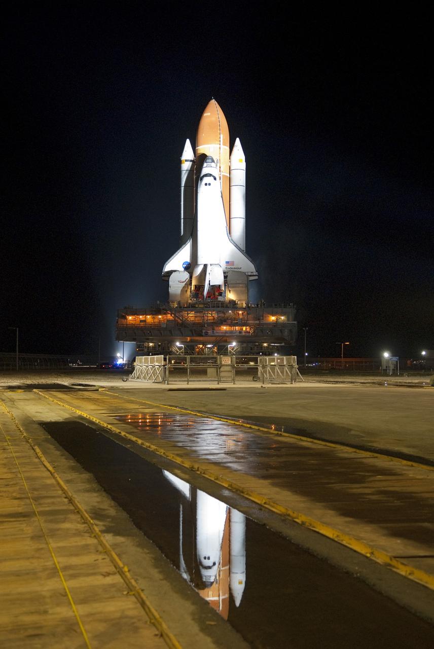 CAPE CANAVERAL, Fla. -- Bathed in xenon lights, space shuttle Endeavour, attached to its external fuel tank and solid rocket boosters, is on a nighttime journey from the Vehicle Assembly Building to Launch Pad 39A at NASA's Kennedy Space Center in Florida. The 3.4-mile trek, known as "rollout," began at 7:56 p.m. EST and will take about seven hours to complete. This is the final scheduled rollout for Endeavour, which is attached to its external fuel tank and solid rocket boosters atop a crawler-transporter. Endeavour and its six STS-134 crew members will deliver the Express Logistics Carrier-3, Alpha Magnetic Spectrometer-2 (AMS), a high-pressure gas tank, additional spare parts for the Dextre robotic helper and micrometeoroid debris shields to the International Space Station on the shuttle's final spaceflight. Launch is targeted for April 19 at 7:48 p.m. EDT. For more information visit, www.nasa.gov/mission_pages/shuttle/shuttlemissions/sts134/index.html. Photo credit: NASA/Jim Grossmann