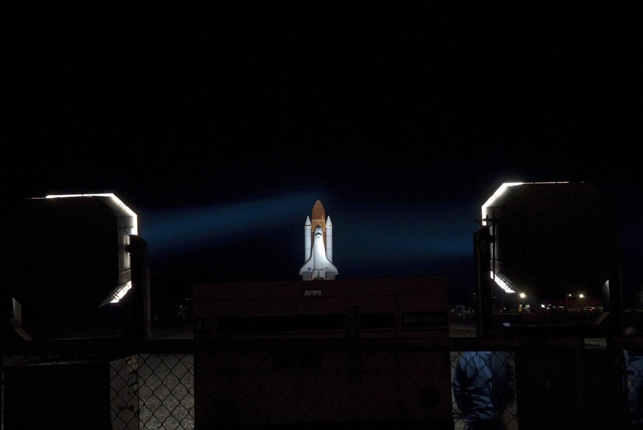 CAPE CANAVERAL, Fla. -- Bathed in xenon lights, space shuttle Endeavour, attached to its external fuel tank and solid rocket boosters, is on a nighttime journey from the Vehicle Assembly Building to Launch Pad 39A at NASA's Kennedy Space Center in Florida. The 3.4-mile trek, known as "rollout," began at 7:56 p.m. EST and will take about seven hours to complete. This is the final scheduled rollout for Endeavour, which is attached to its external fuel tank and solid rocket boosters atop a crawler-transporter. Endeavour and its six STS-134 crew members will deliver the Express Logistics Carrier-3, Alpha Magnetic Spectrometer-2 (AMS), a high-pressure gas tank, additional spare parts for the Dextre robotic helper and micrometeoroid debris shields to the International Space Station on the shuttle's final spaceflight. Launch is targeted for April 19 at 7:48 p.m. EDT. For more information visit, www.nasa.gov/mission_pages/shuttle/shuttlemissions/sts134/index.html. Photo credit: NASA/Jim Grossmann