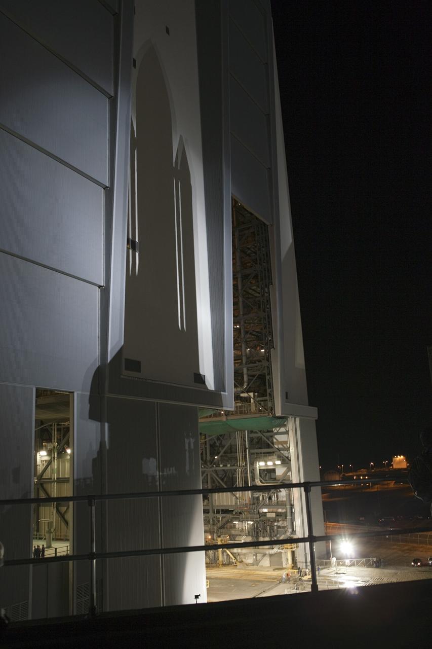 CAPE CANAVERAL, Fla. -- Space shuttle Endeavour, illuminated by xenon lights, casts a shadow on the Vehicle Assembly Building as it begins its nighttime journey to Launch Pad 39A at NASA's Kennedy Space Center in Florida.     Riding atop a crawler-transporter attached to its external fuel tank and solid rocket boosters, Endeavour's 3.4-mile trek, known as "rollout," began at 7:56 p.m. EST and will take about seven hours to complete. This is the final scheduled rollout for Endeavour.  Endeavour and its six-member crew will deliver the Express Logistics Carrier-3, Alpha Magnetic Spectrometer-2 (AMS), a high-pressure gas tank, additional spare parts for the Dextre robotic helper and micrometeoroid debris shields to the International Space Station on the shuttle's final spaceflight, STS-134. Launch is targeted for 7:48 p.m. EDT April 19. For more information, visit www.nasa.gov/mission_pages/shuttle/shuttlemissions/sts134/index.html. Photo credit: NASA/Terry Zaperach