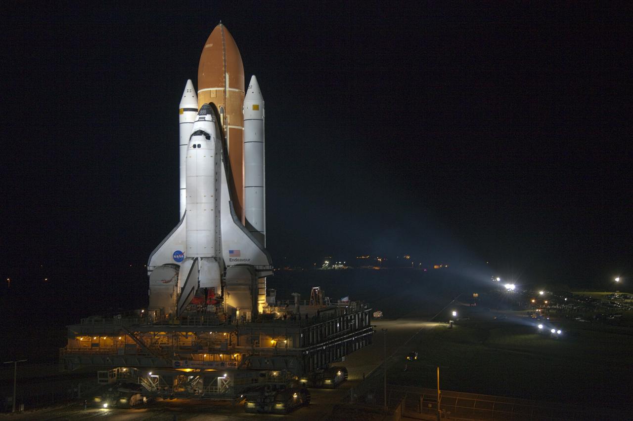 CAPE CANAVERAL, Fla. -- Bathed in xenon lights, space shuttle Endeavour makes its nighttime journey from the Vehicle Assembly Building to Launch Pad 39A at NASA's Kennedy Space Center in Florida.     Riding atop a crawler-transporter attached to its external fuel tank and solid rocket boosters, Endeavour's 3.4-mile trek, known as "rollout," began at 7:56 p.m. EST and will take about seven hours to complete. This is the final scheduled rollout for Endeavour.  Endeavour and its six-member crew will deliver the Express Logistics Carrier-3, Alpha Magnetic Spectrometer-2 (AMS), a high-pressure gas tank, additional spare parts for the Dextre robotic helper and micrometeoroid debris shields to the International Space Station on the shuttle's final spaceflight, STS-134. Launch is targeted for 7:48 p.m. EDT April 19. For more information, visit www.nasa.gov/mission_pages/shuttle/shuttlemissions/sts134/index.html. Photo credit: NASA/Frankie Martin