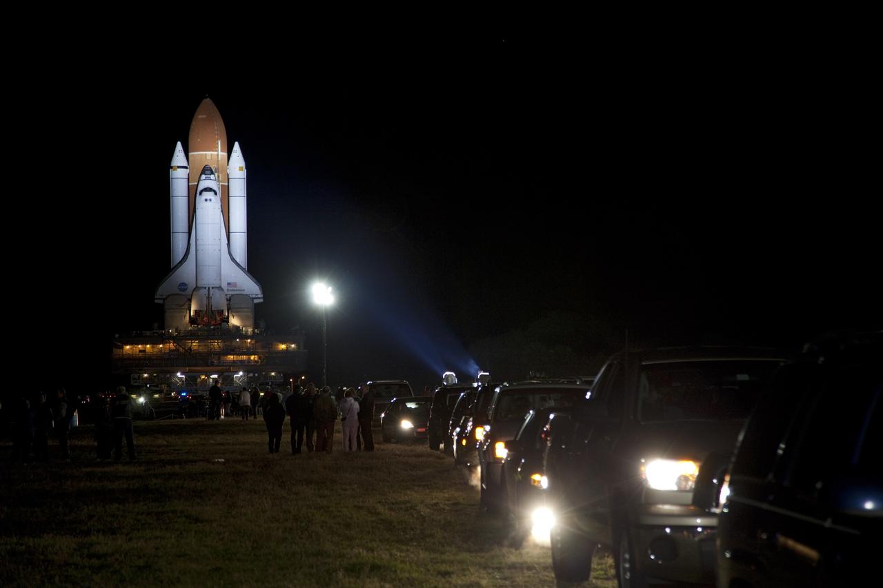 CAPE CANAVERAL, Fla. -- Employees and their friends and families are on hand to witness space shuttle Endeavour, illuminated by xenon lights, on its nighttime journey from the Vehicle Assembly Building to Launch Pad 39A at NASA's Kennedy Space Center in Florida.     Riding atop a crawler-transporter attached to its external fuel tank and solid rocket boosters, Endeavour's 3.4-mile trek, known as "rollout," began at 7:56 p.m. EST and will take about seven hours to complete. This is the final scheduled rollout for Endeavour.  Endeavour and its six-member crew will deliver the Express Logistics Carrier-3, Alpha Magnetic Spectrometer-2 (AMS), a high-pressure gas tank, additional spare parts for the Dextre robotic helper and micrometeoroid debris shields to the International Space Station on the shuttle's final spaceflight, STS-134. Launch is targeted for 7:48 p.m. EDT April 19. For more information, visit www.nasa.gov/mission_pages/shuttle/shuttlemissions/sts134/index.html. Photo credit: NASA/Frankie Martin