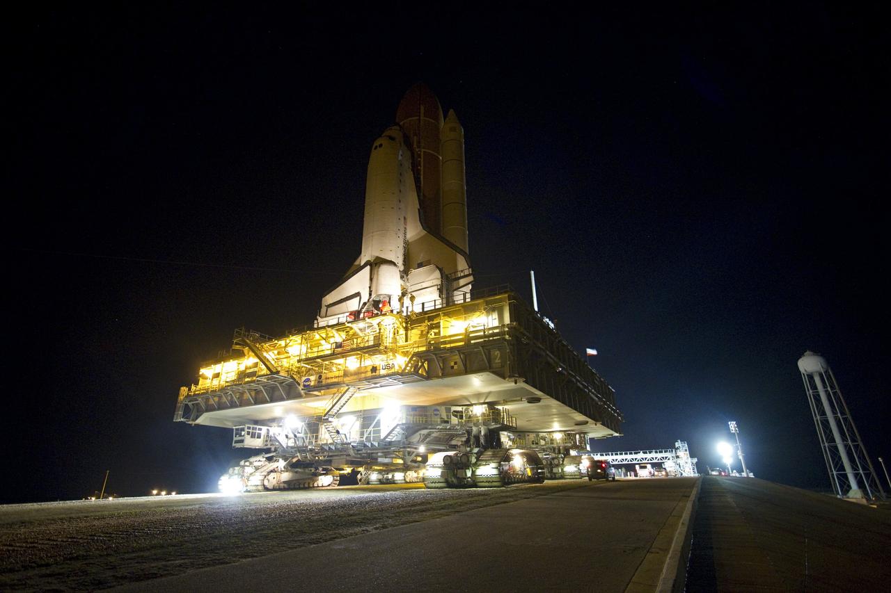 CAPE CANAVERAL, Fla. -- Space shuttle Endeavour navigates the crawlerway's five percent grade to the hardstand at the top of Launch Pad 39A at NASA's Kennedy Space Center in Florida.    Riding atop a crawler-transporter attached to its external fuel tank and solid rocket boosters, Endeavour's 3.4-mile trek, known as "rollout," began at the Vehicle Assembly Building at 7:56 p.m. EST March 10 and ended at 3:49 a.m. EST, nearly eight hours later. This is Endeavour's final scheduled rollout.  Endeavour and its six-member crew will deliver the Express Logistics Carrier-3, Alpha Magnetic Spectrometer-2 (AMS), a high-pressure gas tank, additional spare parts for the Dextre robotic helper and micrometeoroid debris shields to the International Space Station on the shuttle's final spaceflight, STS-134. Launch is targeted for 7:48 p.m. EDT April 19. For more information, visit www.nasa.gov/mission_pages/shuttle/shuttlemissions/sts134/index.html. Photo credit: NASA/Jack Pfaller
