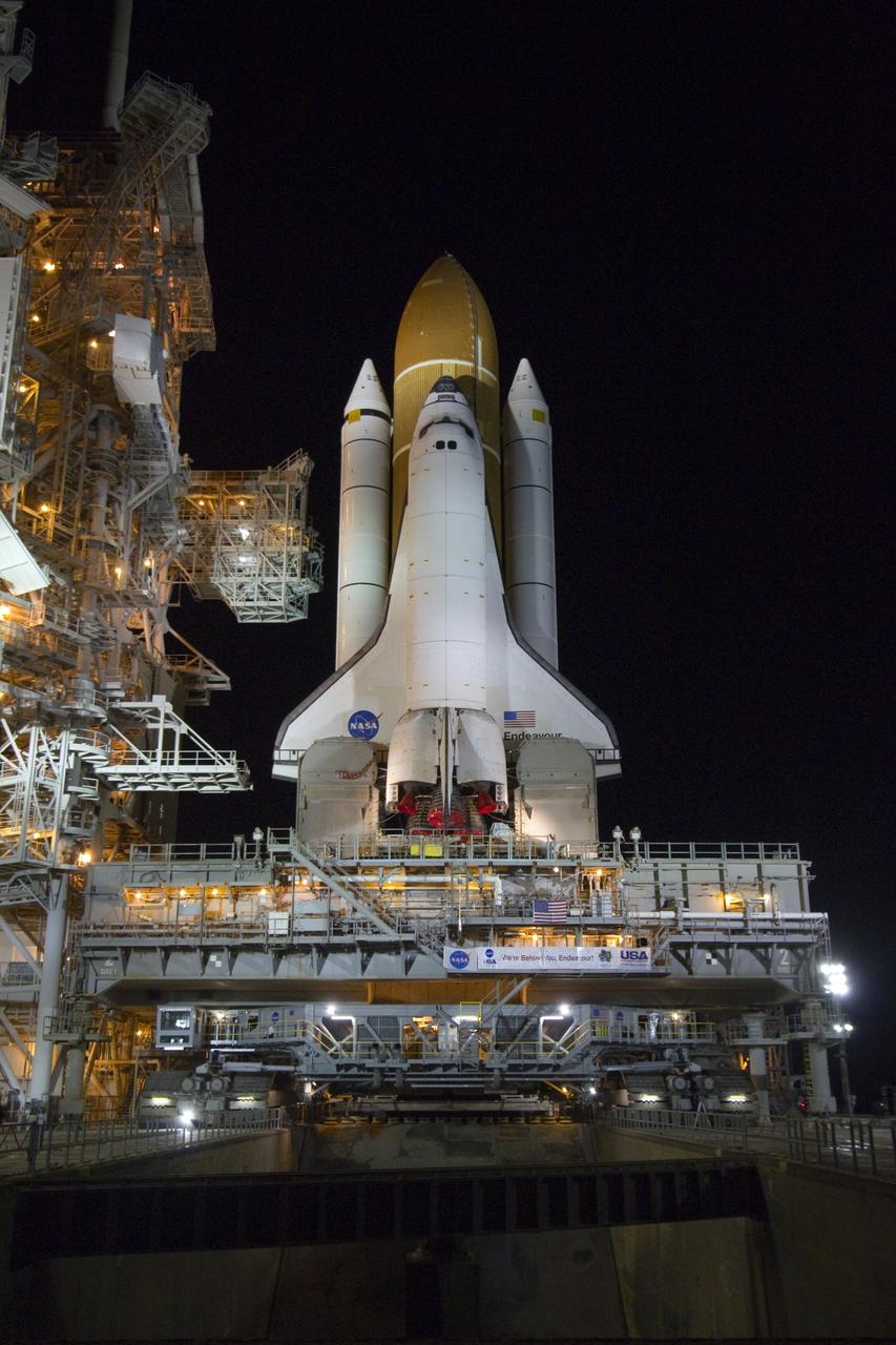 CAPE CANAVERAL, Fla. -- Work is under way to secure space shuttle Endeavour on the six permanent and four extensible pedestals at Launch Pad 39A at NASA's Kennedy Space Center in Florida.    Riding atop a crawler-transporter attached to its external fuel tank and solid rocket boosters, Endeavour's 3.4-mile trek, known as "rollout," began at the Vehicle Assembly Building at 7:56 p.m. EST March 10 and ended at 3:49 a.m. EST, nearly eight hours later. This is Endeavour's final scheduled rollout.  Endeavour and its six-member crew will deliver the Express Logistics Carrier-3, Alpha Magnetic Spectrometer-2 (AMS), a high-pressure gas tank, additional spare parts for the Dextre robotic helper and micrometeoroid debris shields to the International Space Station on the shuttle's final spaceflight, STS-134. Launch is targeted for 7:48 p.m. EDT April 19. For more information, visit www.nasa.gov/mission_pages/shuttle/shuttlemissions/sts134/index.html. Photo credit: NASA/Jack Pfaller