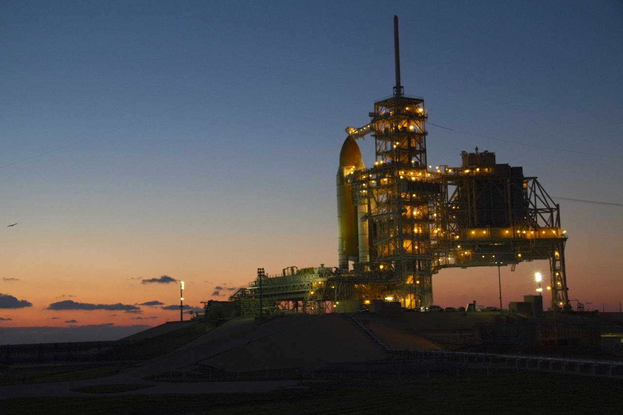 CAPE CANAVERAL, Fla. -- Sunrise over the Space Coast in Florida finds space shuttle Endeavour settling in on Launch Pad 39A at NASA's Kennedy Space Center.    Riding atop a crawler-transporter attached to its external fuel tank and solid rocket boosters, Endeavour's 3.4-mile trek, known as "rollout," began at the Vehicle Assembly Building at 7:56 p.m. EST March 10 and ended at 3:49 a.m. EST, nearly eight hours later. This is Endeavour's final scheduled rollout.  Endeavour and its six-member crew will deliver the Express Logistics Carrier-3, Alpha Magnetic Spectrometer-2 (AMS), a high-pressure gas tank, additional spare parts for the Dextre robotic helper and micrometeoroid debris shields to the International Space Station on the shuttle's final spaceflight, STS-134. Launch is targeted for 7:48 p.m. EDT April 19. For more information, visit www.nasa.gov/mission_pages/shuttle/shuttlemissions/sts134/index.html. Photo credit: NASA/Jack Pfaller